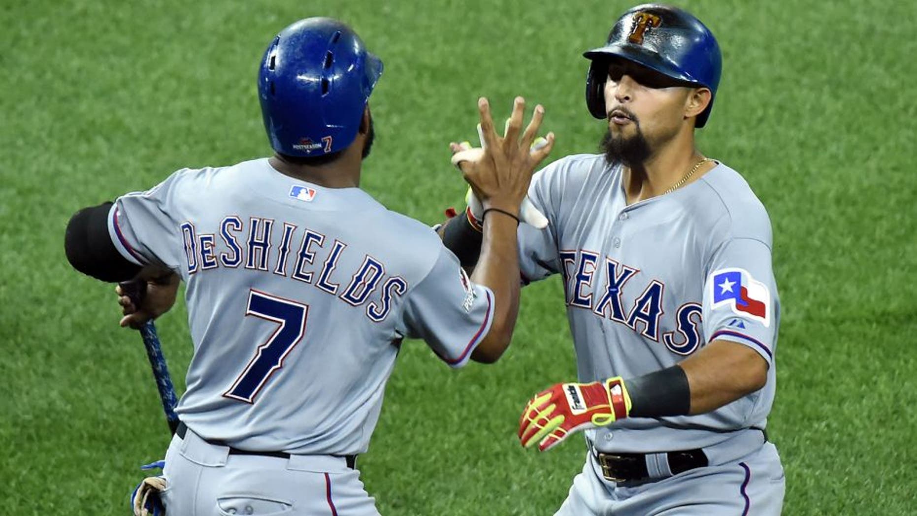Oct 8, 2015; Toronto, Ontario, CAN; Texas Rangers second baseman Rougned Odor (right) celebrates with center fielder Delino DeShields (7) after hitting a solo home run against the Toronto Blue Jays in the 7th inning in game one of the ALDS at Rogers Centre. Mandatory Credit: Dan Hamilton-USA TODAY Sports