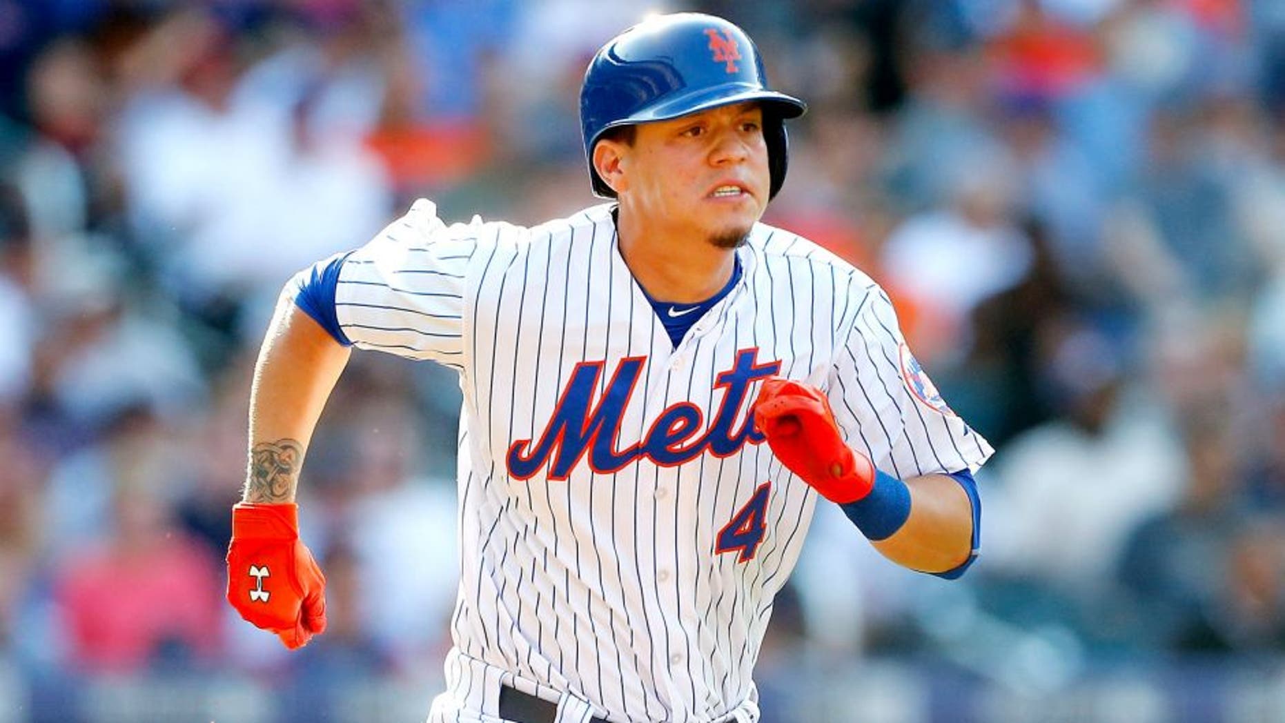 NEW YORK, NY - AUGUST 29: Wilmer Flores #4 of the New York Mets in action against the Boston Red Sox at Citi Field on August 29, 2015 in the Flushing neighborhood of the Queens borough of New York City. The Red Sox defeated the Mets 3-1. (Photo by Jim McIsaac/Getty Images)