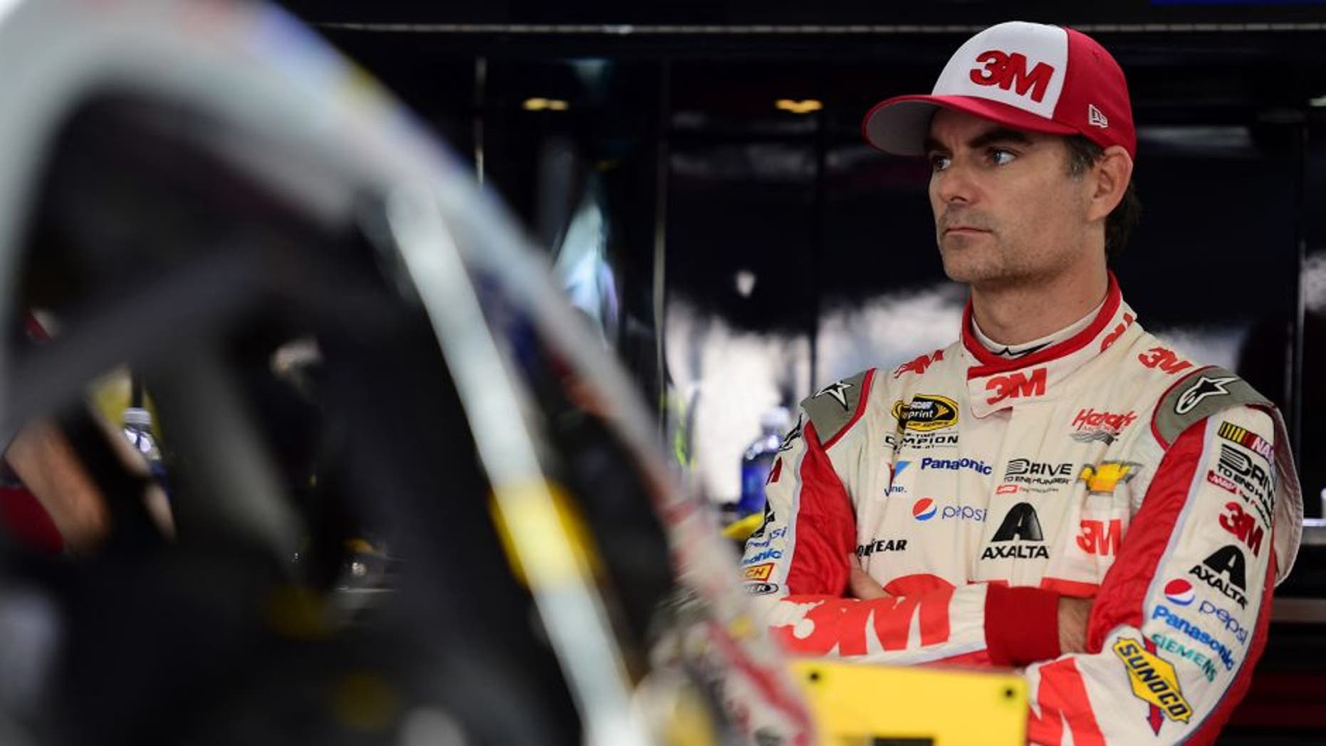 CHARLOTTE, NC - OCTOBER 09: Jeff Gordon, driver of the #24 3M Chevrolet, stands in the garage arstands in the garage areaduring practice for the NASCAR Sprint Cup Series Bank of America 500 at Charlotte Motor Speedway on October 9, 2015 in Charlotte, North Carolina. (Photo by Jared C. Tilton/NASCAR via Getty Images)
