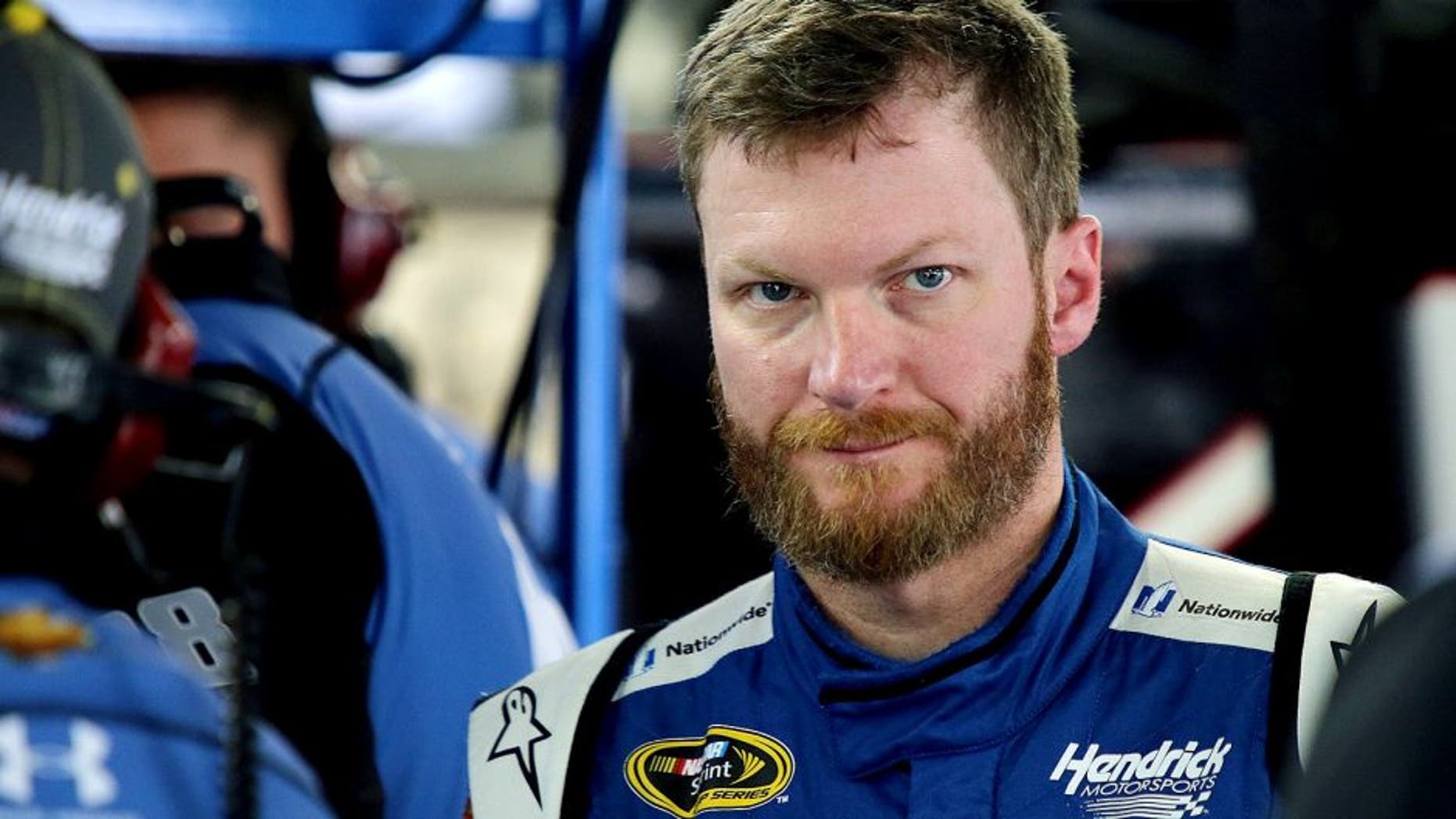 CHARLOTTE, NC - OCTOBER 08: Dale Earnhardt Jr., driver of the #88 Nationwide Chevrolet, stands in the garage during practice for the NASCAR Sprint Cup Series Bank of America 500 at Charlotte Motor Speedway on October 8, 2015 in Charlotte, North Carolina. (Photo by Jerry Markland/Getty Images)