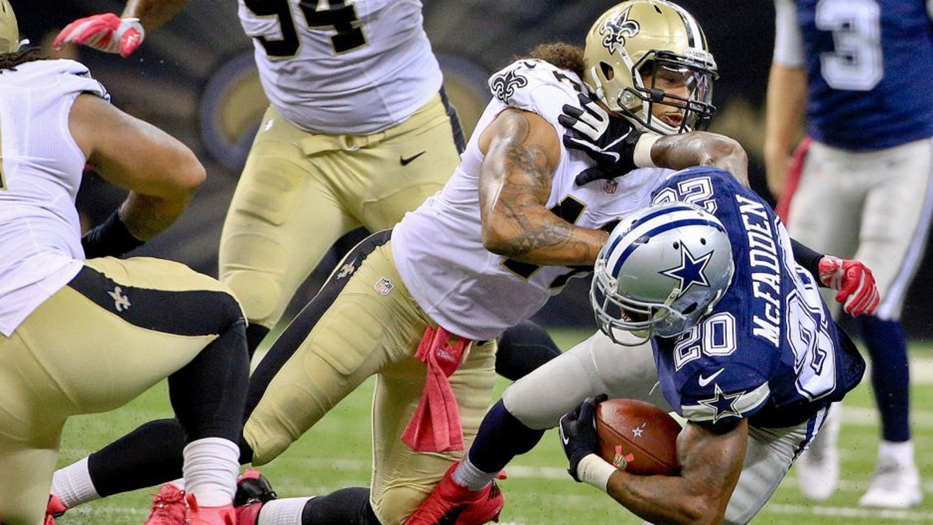 Oct 4, 2015; New Orleans, LA, USA; New Orleans Saints outside linebacker Hau'oli Kikaha (44) tackles Dallas Cowboys running back Darren McFadden (20) during the second half at the Mercedes-Benz Superdome. The Saints won 26-20 in overtime. Mandatory Credit: Derick E. Hingle-USA TODAY Sports