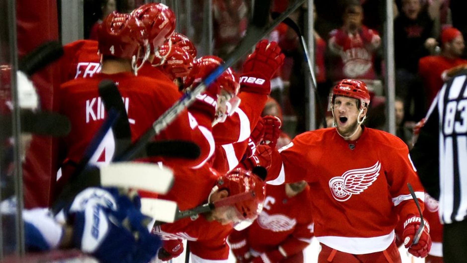 Oct 9, 2015; Detroit, MI, USA; Detroit Red Wings left wing Justin Abdelkader (8) celebrates his goal and hat trick during the second period against the Toronto Maple Leafs at Joe Louis Arena. Mandatory Credit: Tim Fuller-USA TODAY Sports