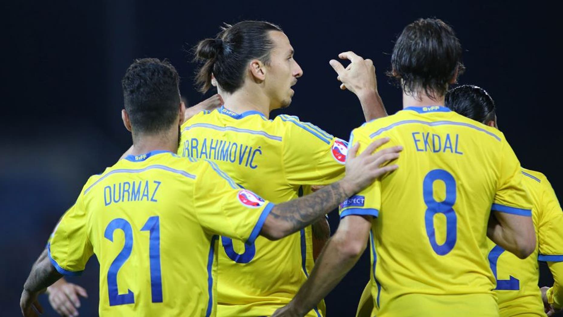 Swedens Zlatan Ibrahimovic (2nd L) celebrates with teammates Jimmy Durmaz (L) and Albin Ekdal after scoring his team's second goal during the Euro 2016 Group G qualifying football match between Liechtenstein and Sweden at the Rheinpark stadium in Vaduz on October 9, 2015. AFP PHOTO / MICHELE LIMINA (Photo credit should read MICHELE LIMINA/AFP/Getty Images)