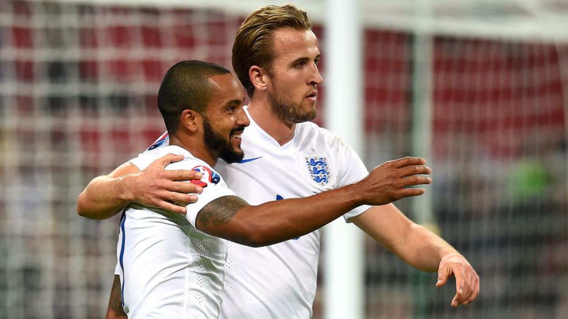 LONDON, ENGLAND - OCTOBER 09: Theo Walcott and Harry Kane of England celebrate after scoring the opening goal during the UEFA EURO 2016 Group E Qualifier match between England and Estonia at Wembley Stadium on October 9, 2015 in London, United Kingdom. (Photo by Michael Regan - The FA/The FA via Getty Images)
