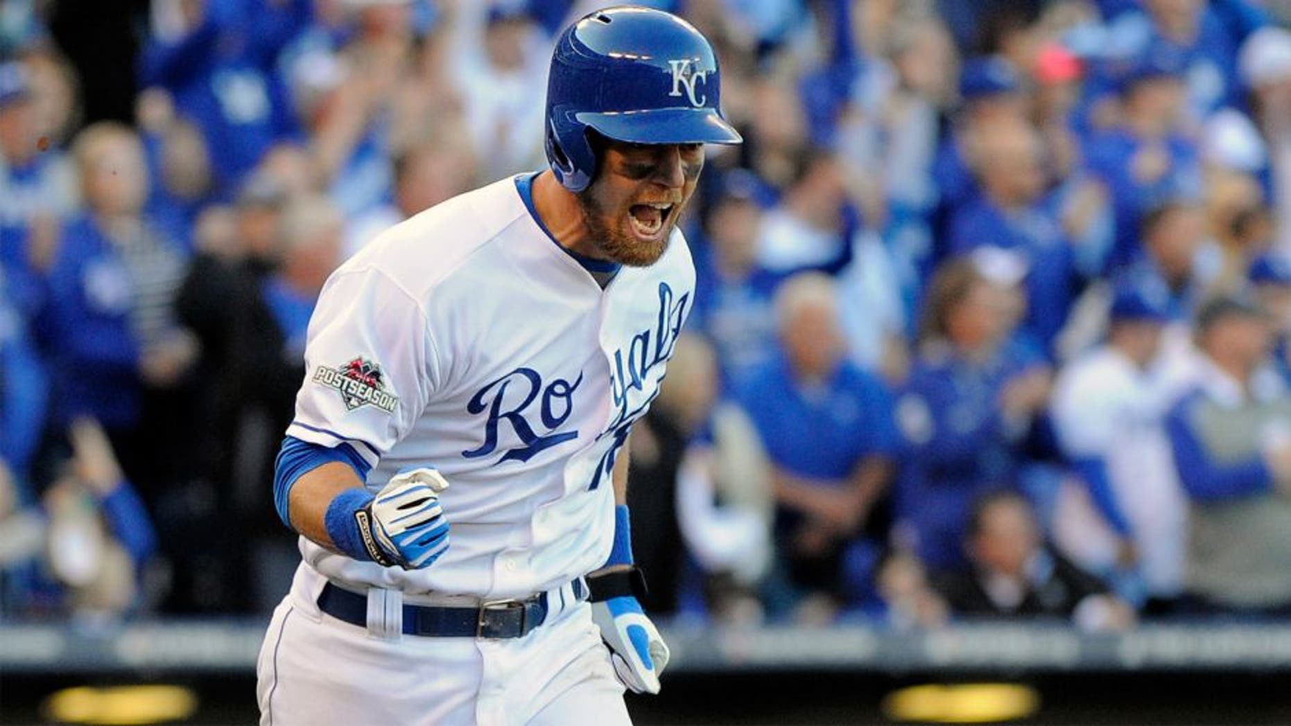 KANSAS CITY, MO - OCTOBER 09: Ben Zobrist #18 of the Kansas City Royals celebrates hitting an RBI single in the seventh inning against Will Harris #36 of the Houston Astros to score Alcides Escobar #2 during game two of the American League Division Series at Kauffman Stadium on October 9, 2015 in Kansas City, Missouri. (Photo by Ed Zurga/Getty Images)