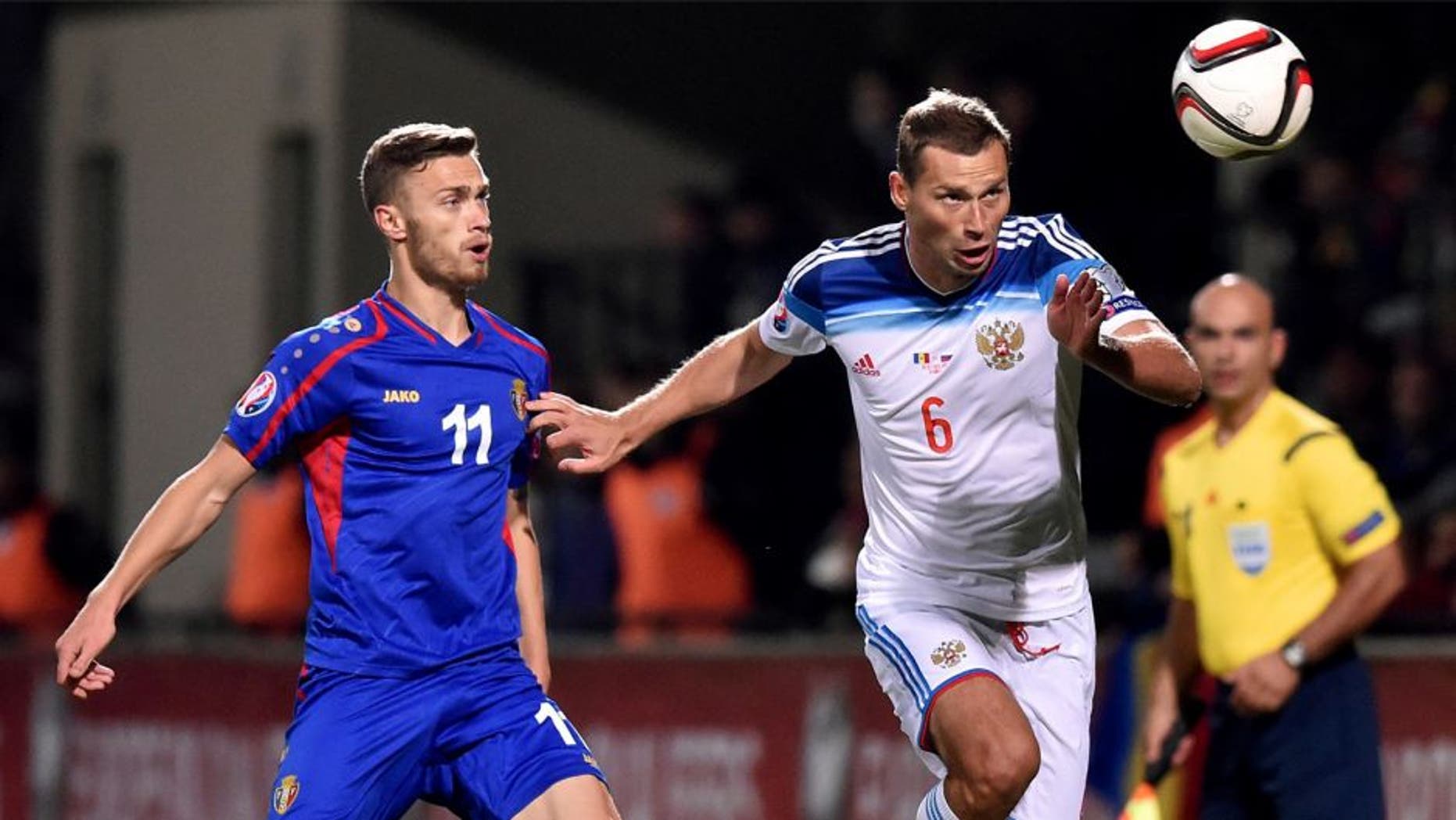 Russia's defender Aleksei Berezutski (R) vies Moldova's forward Nicolae Milinceanu during the Euro 2016 qualifying football match between Russia and Moldova at the Stadionul Zimbru in Chisinau on October 9, 2015. AFP PHOTO / KIRILL KUDRYAVTSEV (Photo credit should read KIRILL KUDRYAVTSEV/AFP/Getty Images)