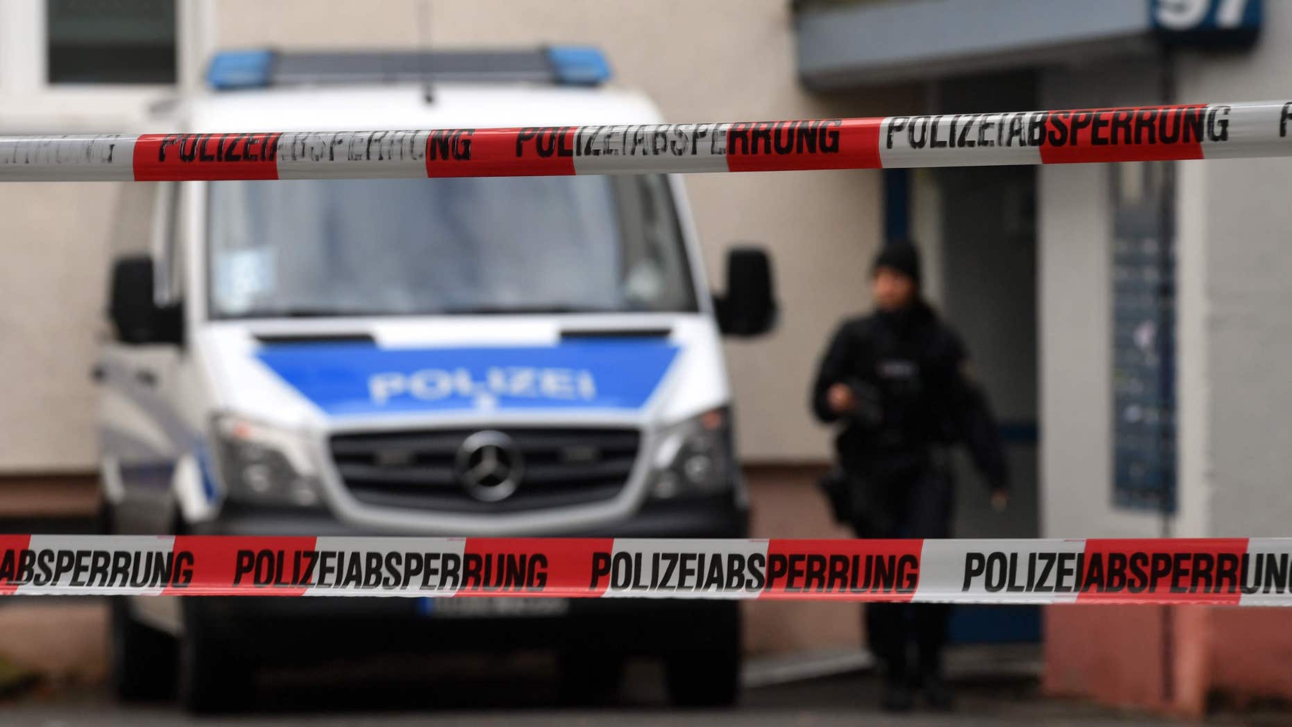 Oct. 9, 2016: Police officers secure a cordoned off residential property in a housing estate in Chemnitz, eastern Germany.