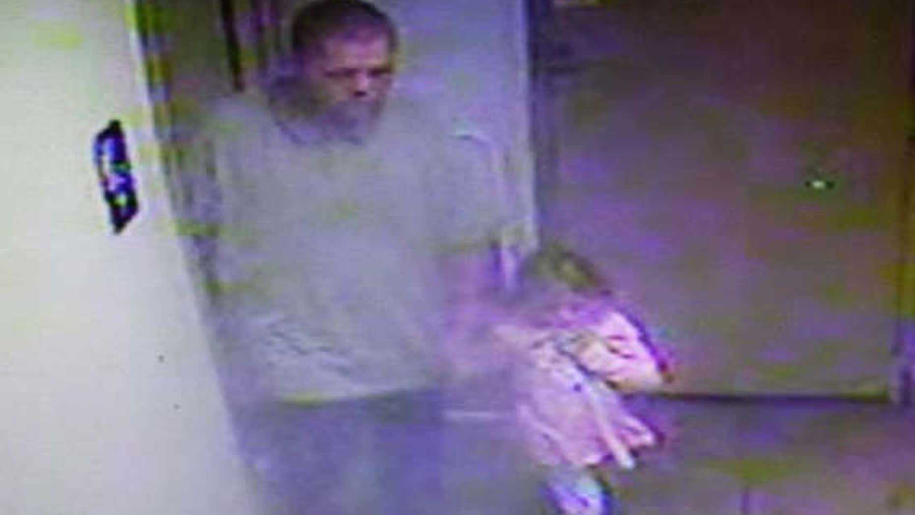 Surveillance footage taken from a Georgia gas station shows West Wild Hogs and Rebecca Lewis.