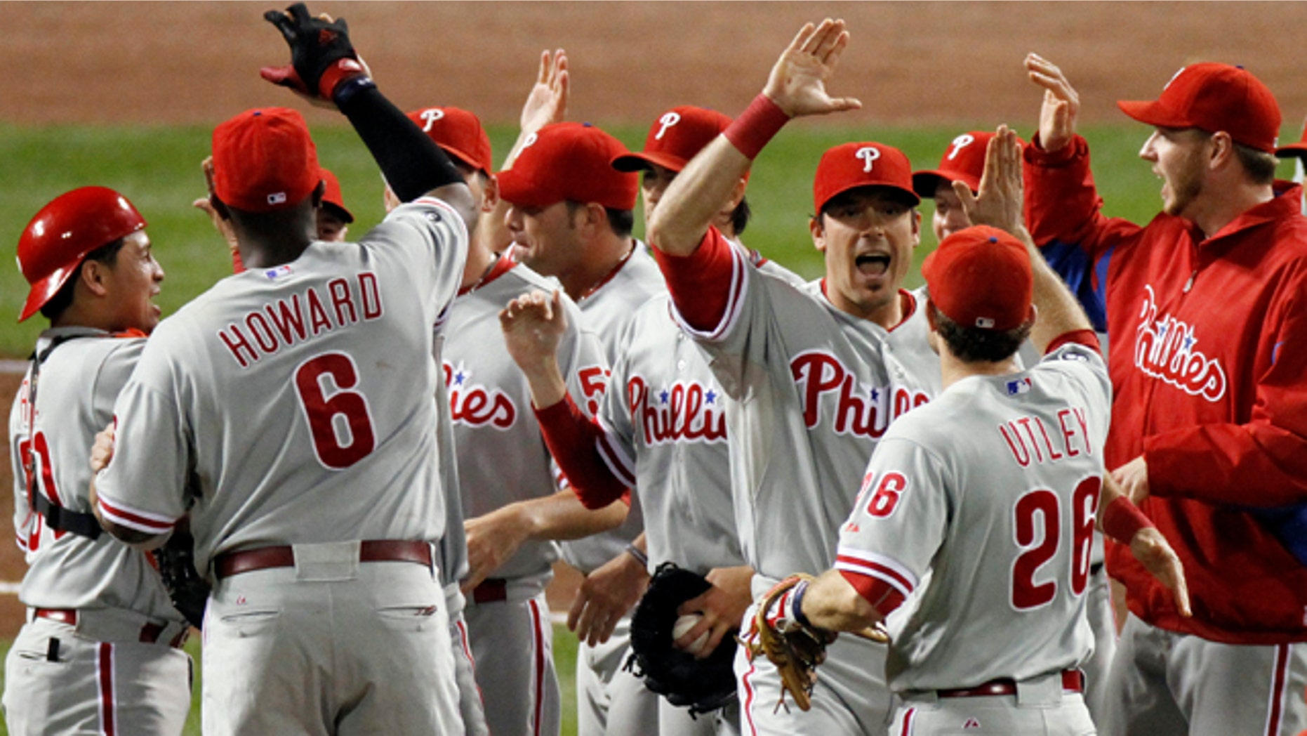 Oct. 10: The Philadelphia Phillies celebrate after beating the Cincinnati Reds 2-0 in Game 3 of baseball's National League Division Series in Cincinnati.