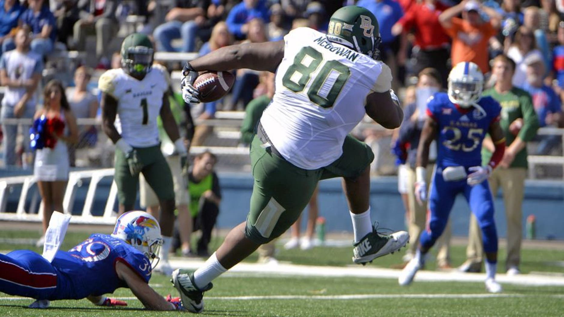 Oct 10, 2015; Lawrence, KS, USA; BBaylor Bears tight end LaQuan McGowan (80) scores a touchdown after catching a pass against Kansas Jayhawks safety Michael Glatczak (39) in the first half at Memorial Stadium. Mandatory Credit: John Rieger-USA TODAY Sports