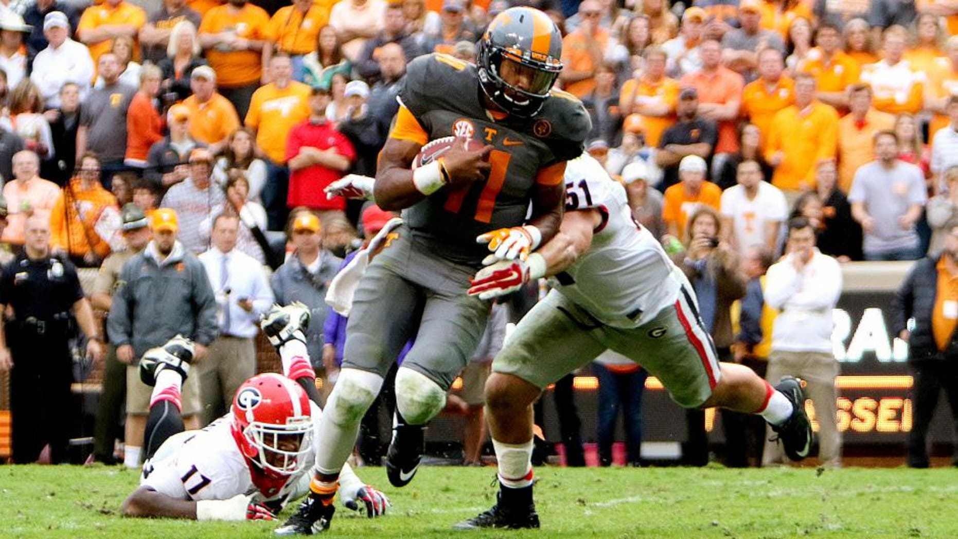 Oct 10, 2015; Knoxville, TN, USA; Tennessee Volunteers quarterback Joshua Dobbs (11) runs for a touchdown against the Georgia Bulldogs during the second half at Neyland Stadium. Mandatory Credit: Randy Sartin-USA TODAY Sports
