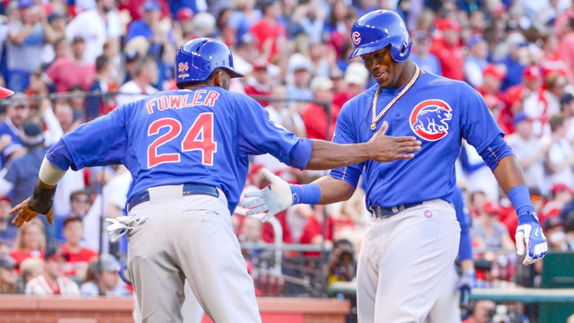 Oct 10, 2015; St. Louis, MO, USA; Chicago Cubs right fielder Jorge Soler (right) is congratulated by center fielder Dexter Fowler (24) for both scoring on a two-run home run by Soler against the St. Louis Cardinals during the second inning in game two of the NLDS at Busch Stadium. Mandatory Credit: Jeff Curry-USA TODAY Sports