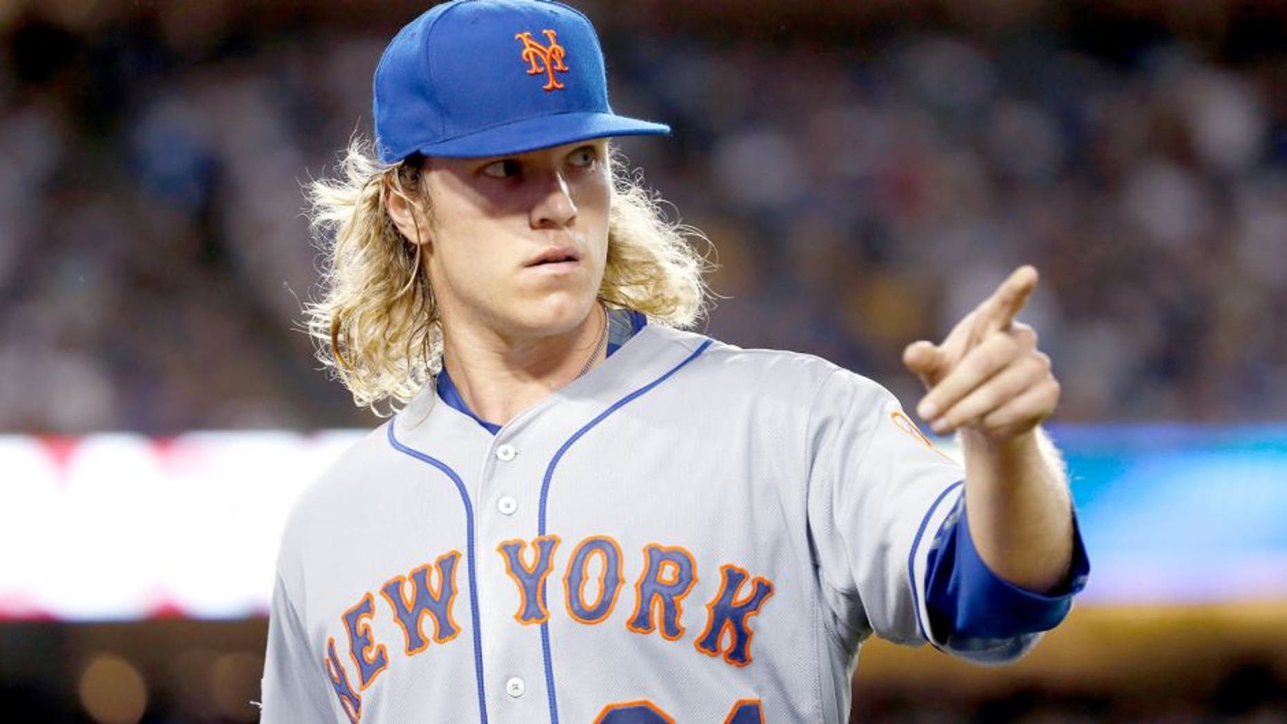 LOS ANGELES, CA - OCTOBER 10: Noah Syndergaard #34 of the New York Mets reacts after recording the final out of the second inning against the Los Angeles Dodgers in game two of the National League Division Series at Dodger Stadium on October 10, 2015 in Los Angeles, California. (Photo by Sean M. Haffey/Getty Images)