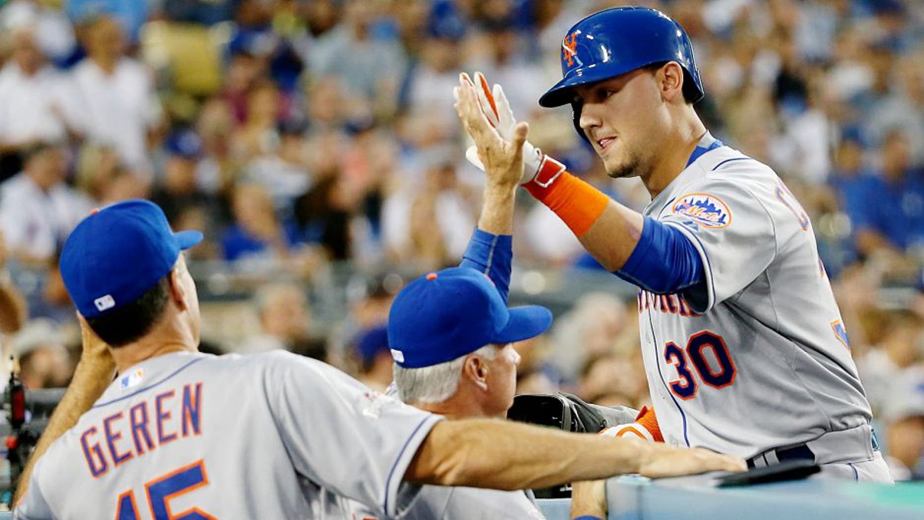 LOS ANGELES, CA - OCTOBER 10: Michael Conforto #30 of the New York Mets celebrates with manager Terry Collins #10 after hitting a solo home run in the second inning against the Los Angeles Dodgers in game two of the National League Division Series at Dodger Stadium on October 10, 2015 in Los Angeles, California. (Photo by Sean M. Haffey/Getty Images)