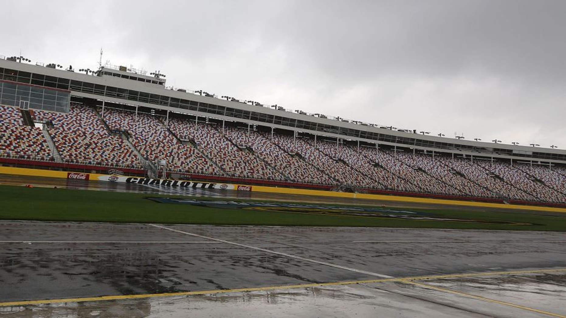 CHARLOTTE, NC - MAY 15: Rain falls on the speedway prior to practice being cancelled for the NASCAR Camping World Truck Series NC Education Lottery 200 at Charlotte Motor Speedway on May 15, 2014 in Charlotte, North Carolina. (Photo by Jerry Markland/Getty Images)