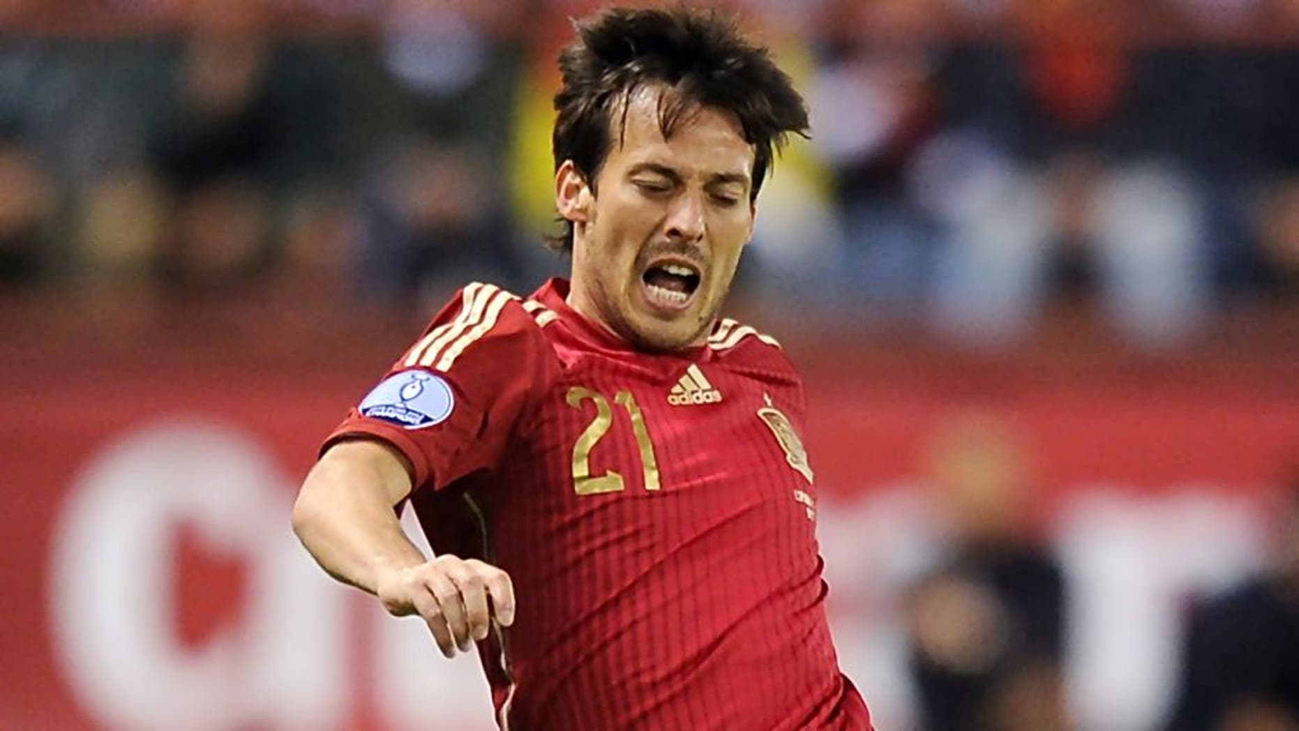 LOGRONO, SPAIN - OCTOBER 09: David Silva of Spain is fouled by Lars Gerson of Luxembourg during the UEFA EURO 2016 Qualifier group C match between Spain and Luxembourg at Estadio Municipal Las Gaunas on October 9, 2015 in Logrono, Spain. (Photo by Denis Doyle/Getty Images)