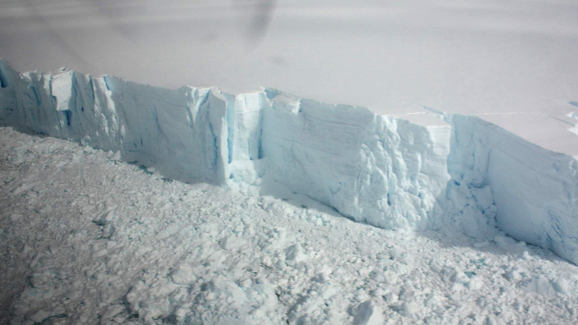 January 18, 2009: A 20 metre-high ice cliff forming the edge of the Wilkins Ice shelf on the Antarctic Peninsula is seen from a plane.