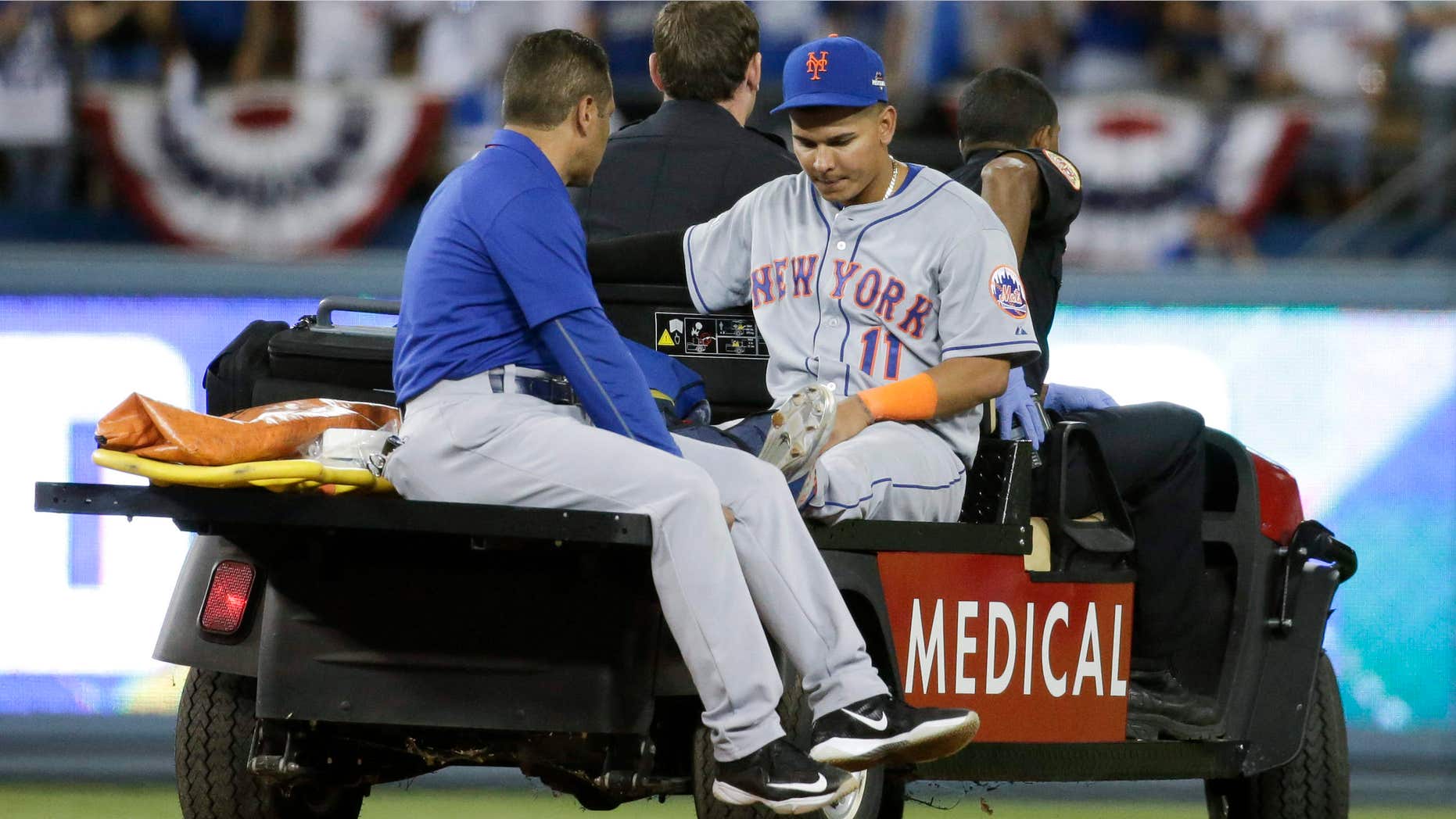 Oct. 10, 2015: New York Mets shortstop Ruben Tejada is taken off the field after being hurt in a double play against the Los Angeles Dodgers during the seventh inning in Game 2 of baseball's National League Division Series.