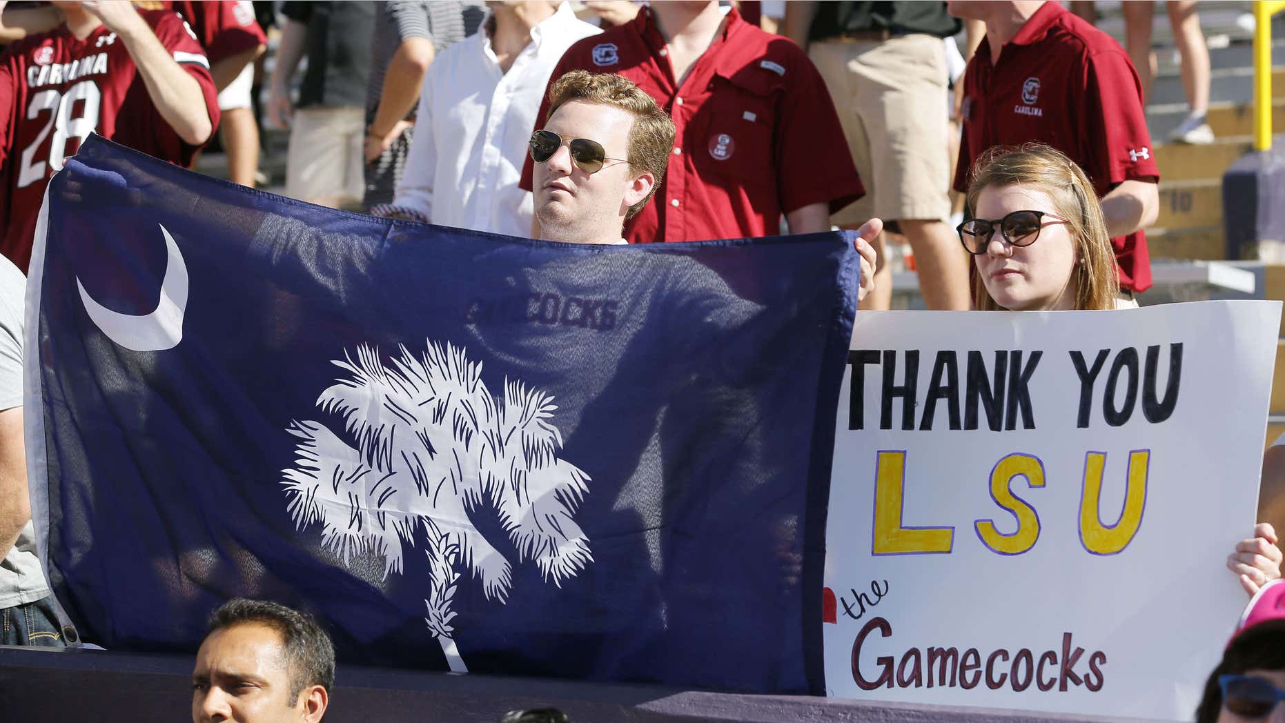 Oct. 10, 2015: Fans hold a signs in support of South Carolina during the first half of an NCAA college football game between LSU and South Carolina in Baton Rouge, La.