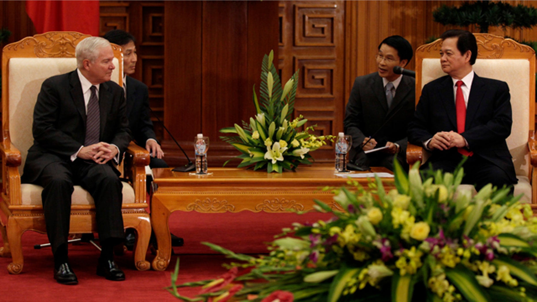 Oct. 11: Defense Secretary Robert Gates, left, meets with Vietnam's Prime Minister Nguyen Tan Dung in a meeting room at the Prime Minister's office in Hanoi, Vietnam.