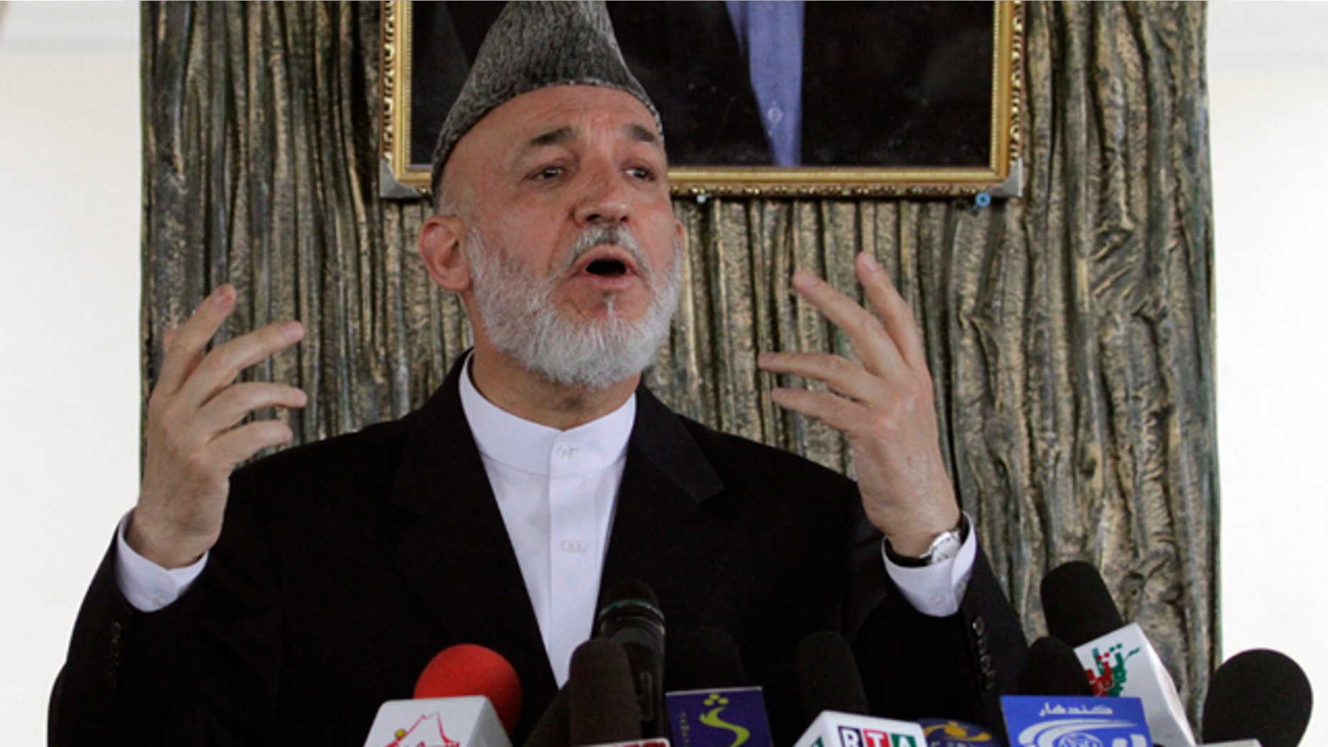 Oct. 11: Afghan President Hamid Karzai talks to Afghans in Argandab district of Kandahar province, south of Kabul, Afghanistan.