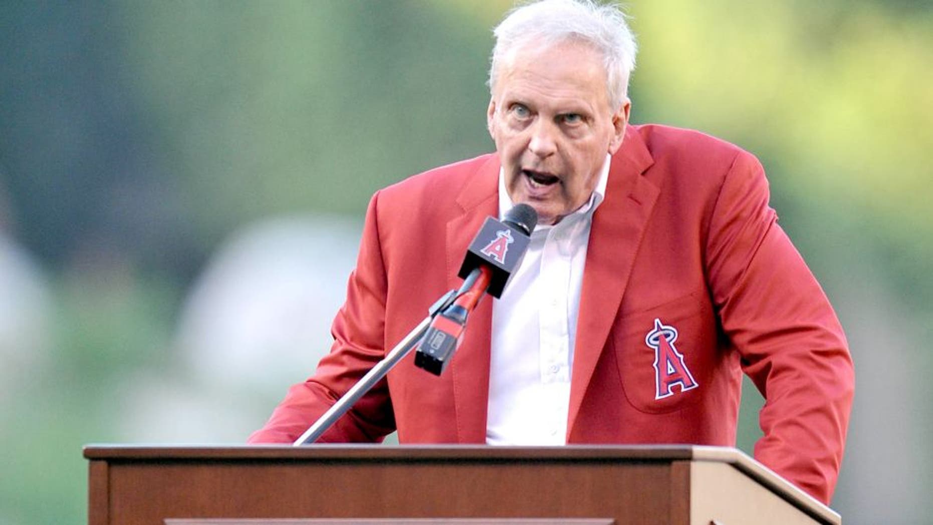 August 22, 2015; Anaheim, CA, USA; Former Los Angeles Angels player Dean Chance speaks at his Angels hall of fame induction before the game against the Toronto Blue Jays at Angel Stadium of Anaheim. Mandatory Credit: Gary A. Vasquez-USA TODAY Sports