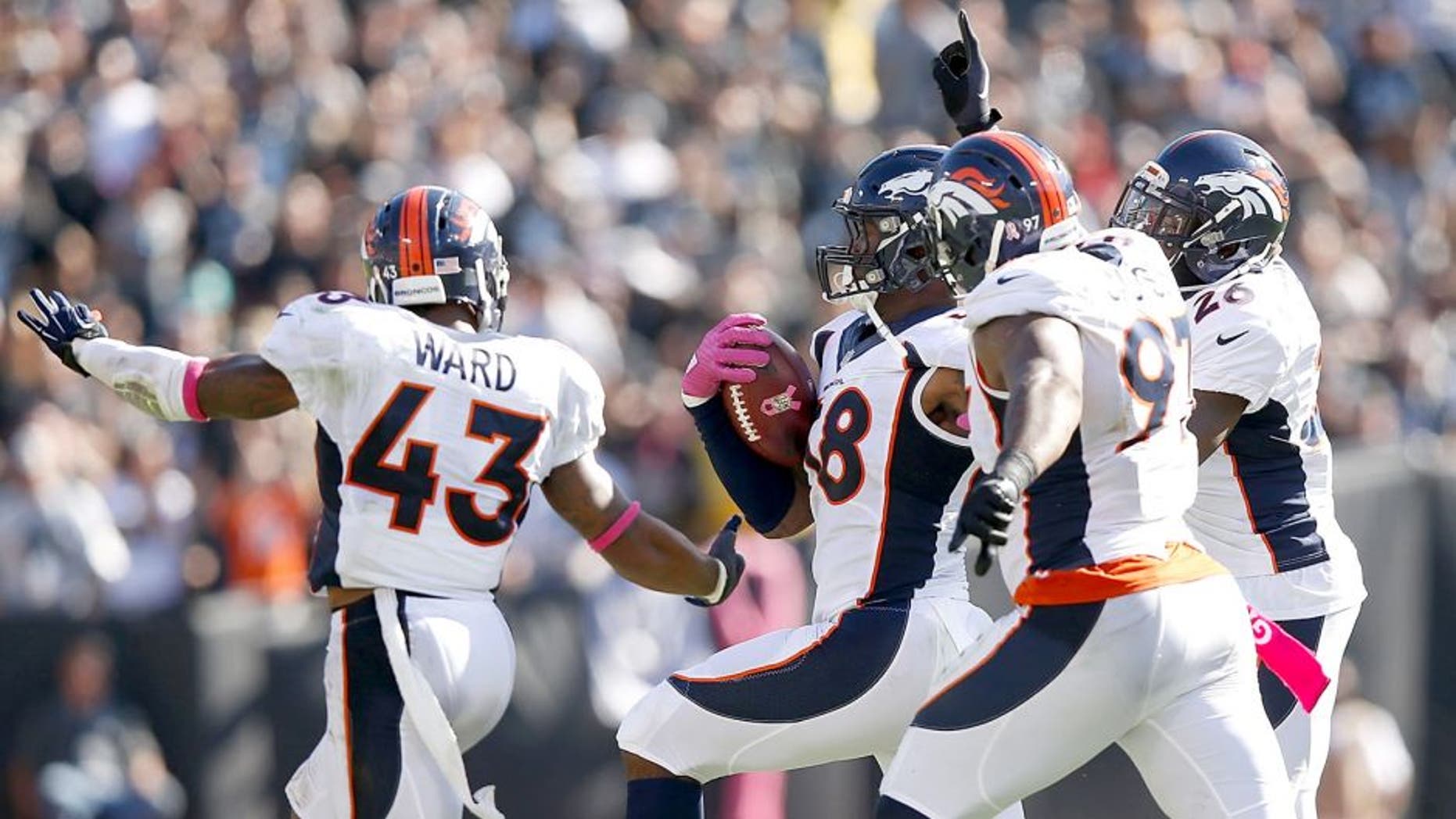 OAKLAND, CA - OCTOBER 11: Von Miller #58 of the Denver Broncos celebrates in the third quarter with teammates T.J. Ward #43 of the Denver Broncos, Malik Jackson #97 of the Denver Broncos and Darian Stewart #26 of the Denver Broncos against the Oakland Raiders at O.co Coliseum on October 11, 2015 in Oakland, California. (Photo by Ezra Shaw/Getty Images)
