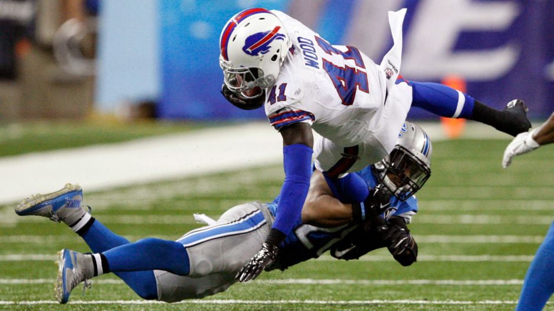 Sep 3, 2015; Detroit, MI, USA; Buffalo Bills running back Cierre Wood (41) gets tackled by Detroit Lions cornerback Quandre Diggs (28) during the fourth quarter of a preseason NFL football game at Ford Field. Lions beat the Bills 17-10. Mandatory Credit: Raj Mehta-USA TODAY Sports