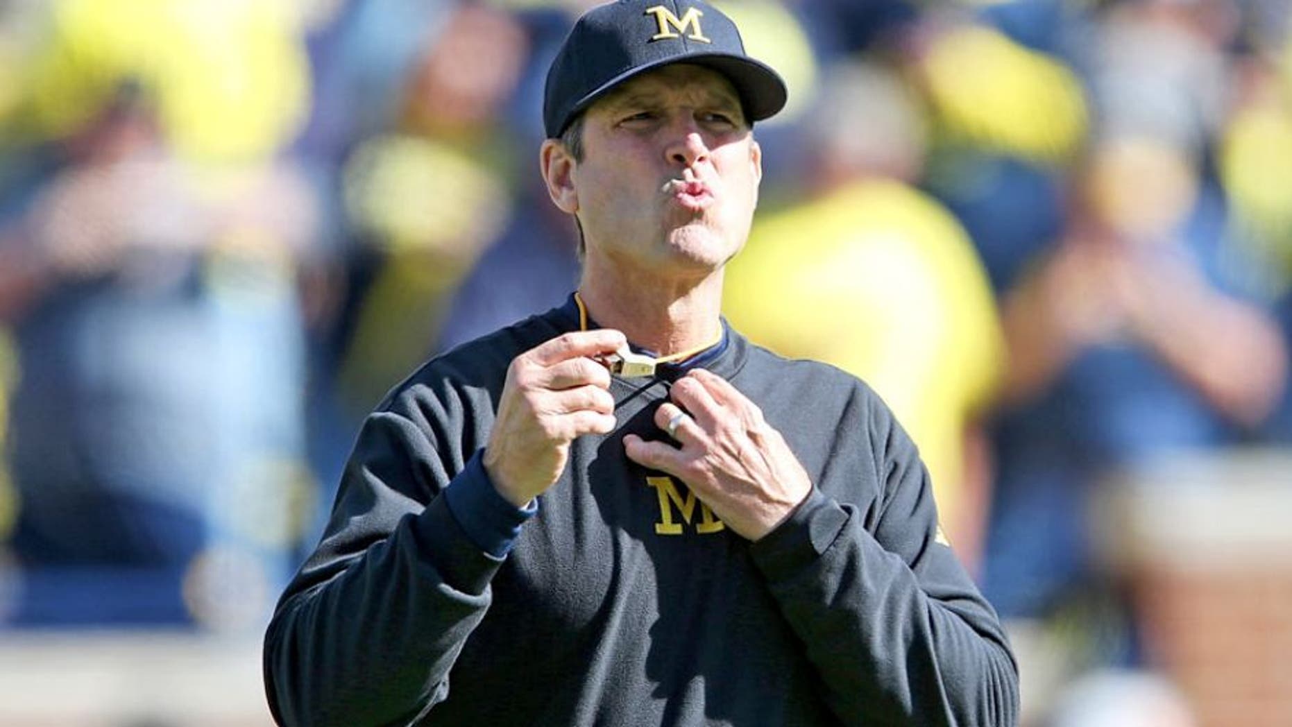 ANN ARBOR MI - OCTOBER 10: Michigan Wolverines head football coach Jim Harbaugh watches the pregame warms ups prior to the start of the game against the Northwestern Wildcats on October 10, 2015 at Michigan Stadium in Ann Arbor, Michigan. The Wolverines defeated the Wildcats 38-0. (Photo by Leon Halip/Getty Images)