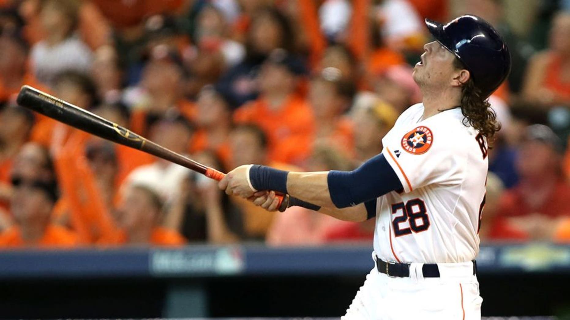 Oct 11, 2015; Houston, TX, USA; Houston Astros left fielder Colby Rasmus (28) hits a single off of the roof against the Kansas City Royals in game three of the ALDS at Minute Maid Park. Astros won 4-2. Mandatory Credit: Troy Taormina-USA TODAY Sports