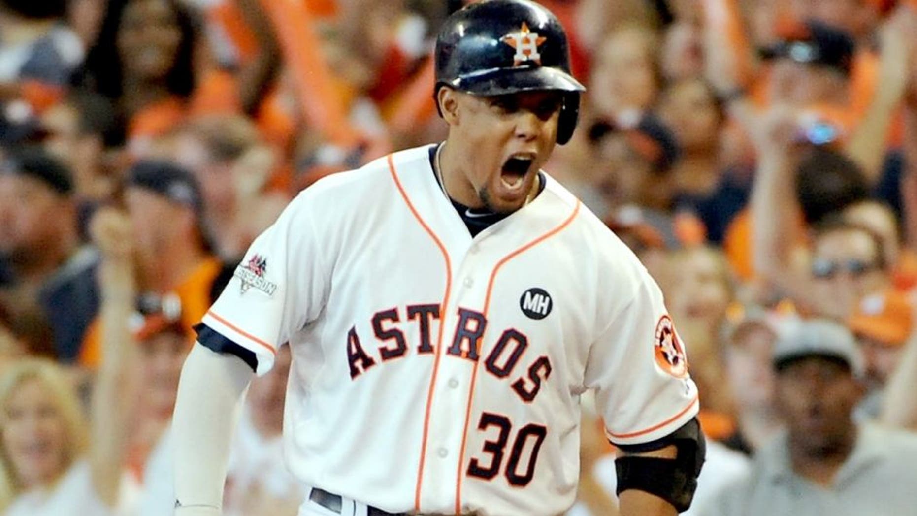 HOUSTON, TX - OCTOBER 11: Carlos Gomez #30 of the Houston Astros reacts after hitting an RBI single in the sixth inning against the Kansas City Royals in game three of the American League Division Series at Minute Maid Park on October 11, 2015 in Houston, Texas. (Photo by Eric Christian Smith/Getty Images)