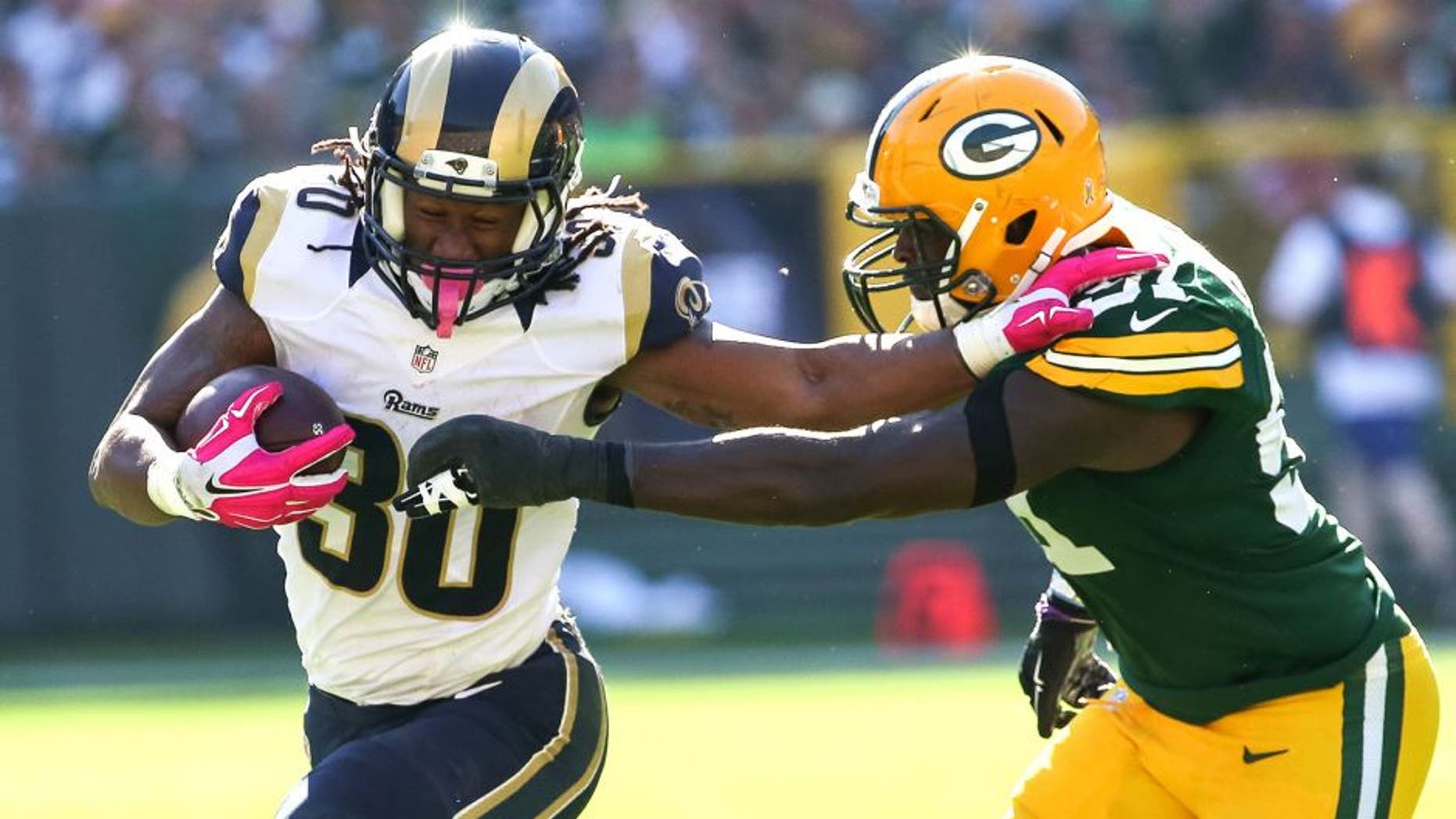 GREEN BAY, WI - OCTOBER 11: Todd Gurley #30 of the St. Louis Rams carries the football against Nate Palmer #51 of the Green Bay Packers in the third quarter at Lambeau Field on October 11, 2015 in Green Bay, Wisconsin. (Photo by Jonathan Daniel/Getty Images)