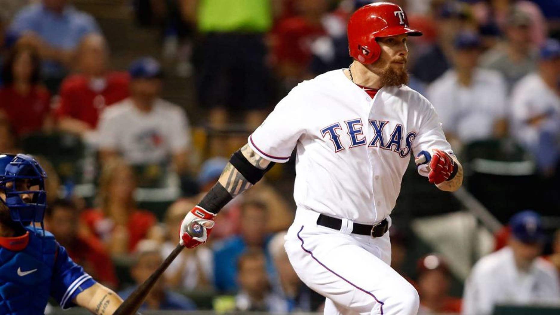 Oct 11, 2015; Arlington, TX, USA; Texas Rangers left fielder Josh Hamilton hits a single against the Toronto Blue Jays in the fifth inning in game three of the ALDS at Globe Life Park in Arlington. Mandatory Credit: Tim Heitman-USA TODAY Sports