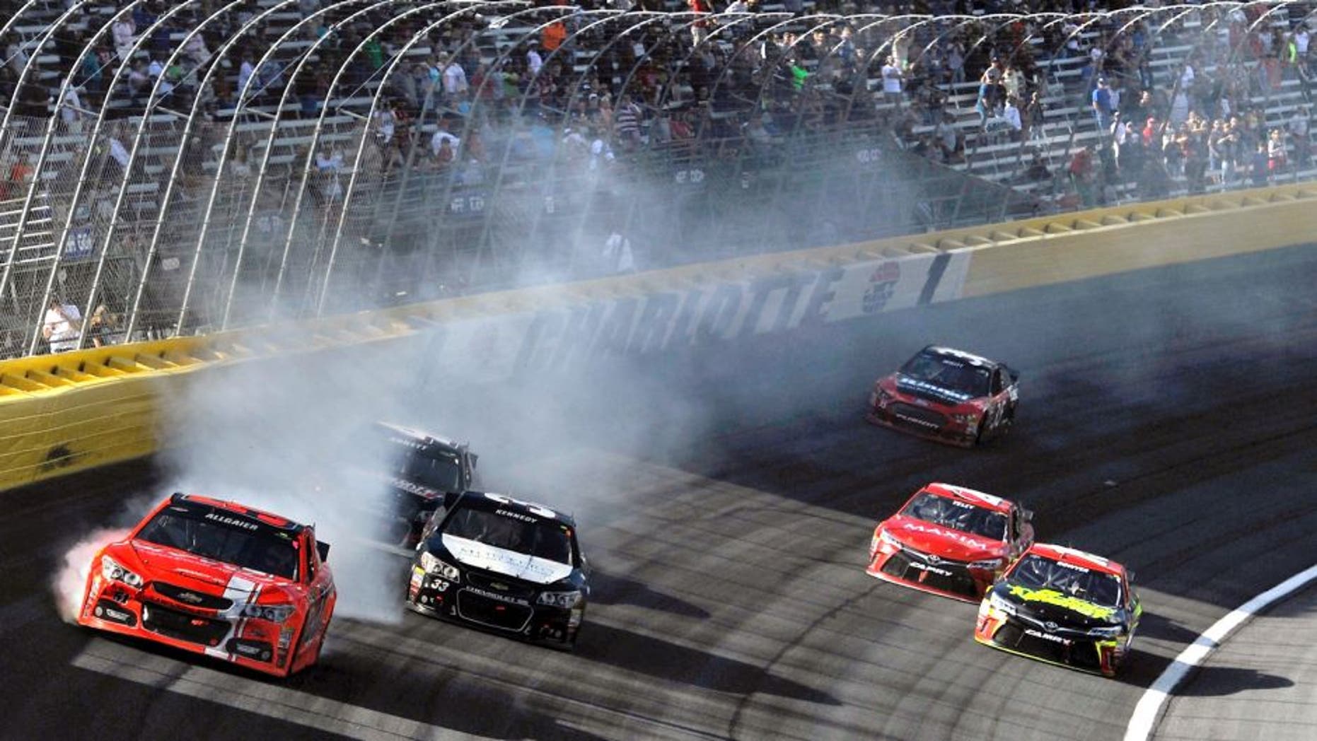 CHARLOTTE, NC - OCTOBER 11: Justin Allgaier, driver of the #51 Brandt Chevrolet, is involved in an on-track incident during the NASCAR Sprint Cup Series Bank of America 500 at Charlotte Motor Speedway on October 11, 2015 in Charlotte, North Carolina. (Photo by Jared C. Tilton/NASCAR via Getty Images)