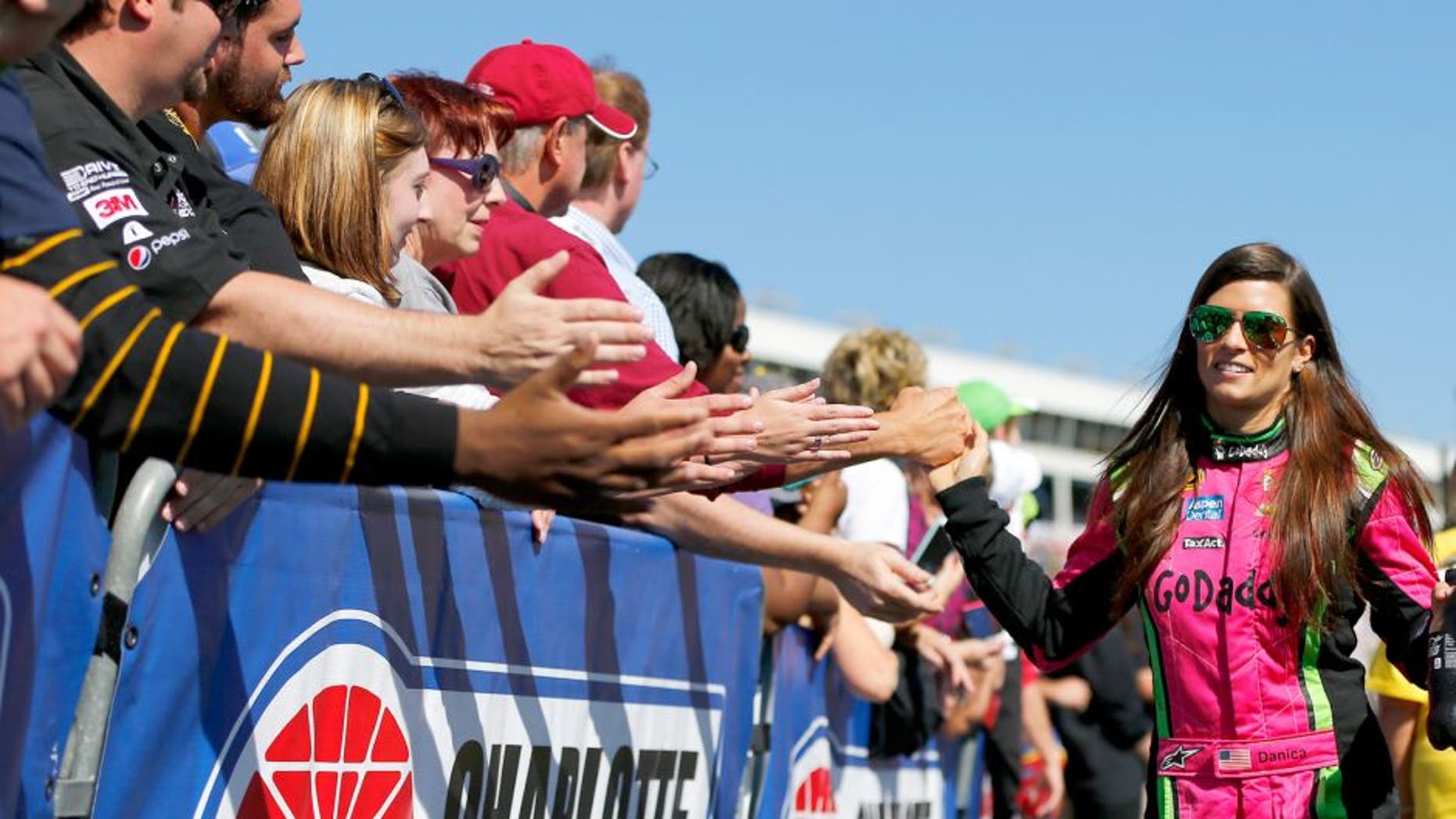 CHARLOTTE, NC - OCTOBER 11: Danica Patrick, driver of the #10 GoDaddy Chevrolet, greets fans prior to the NASCAR Sprint Cup Series Bank of America 500 at Charlotte Motor Speedway on October 11, 2015 in Charlotte, North Carolina. (Photo by Jonathan Ferrey/Getty Images)