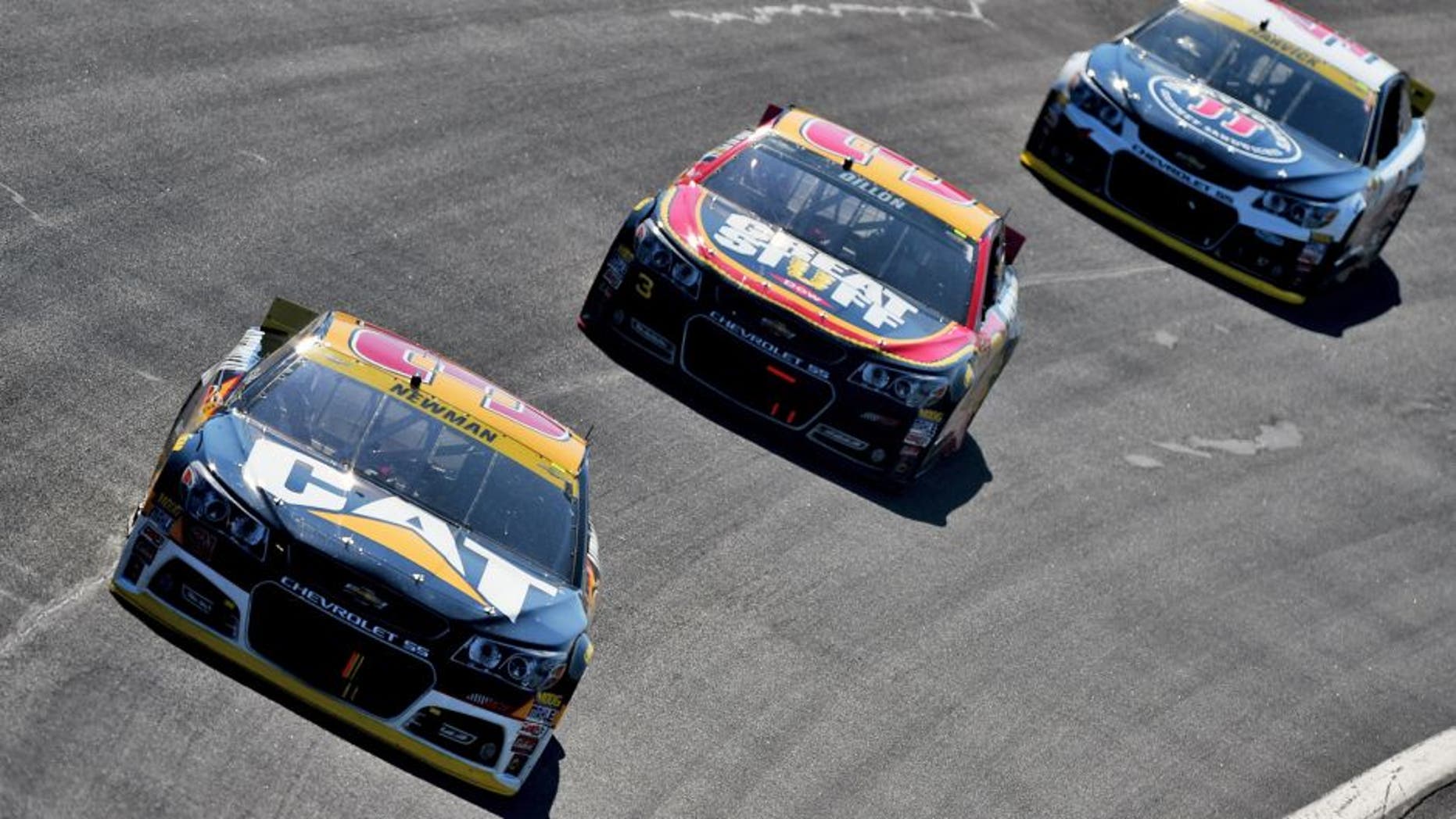 CHARLOTTE, NC - OCTOBER 11: Ryan Newman, driver of the #31 Caterpillar Chevrolet, leads Austin Dillon, driver of the #3 DOW - Great Stuff Chevrolet, and Kevin Harvick, driver of the #4 Jimmy John's/Budweiser Chevrolet, during the NASCAR Sprint Cup Series Bank of America 500 at Charlotte Motor Speedway on October 11, 2015 in Charlotte, North Carolina. (Photo by Josh Hedges/Getty Images)