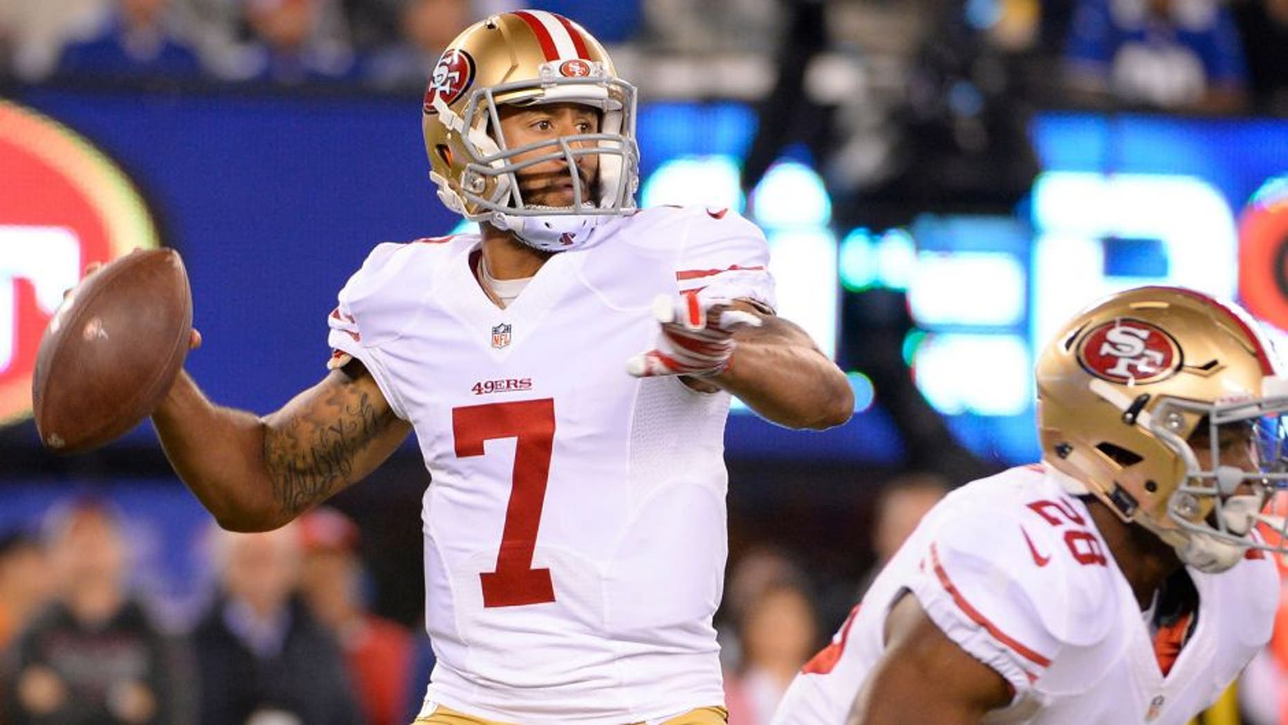 Oct 11, 2015; East Rutherford, NJ, USA; San Francisco 49ers quarterback Colin Kaepernick (7) throws the ball against the New York Giants in the second quarter at MetLife Stadium. Mandatory Credit: Robert Deutsch-USA TODAY Sports
