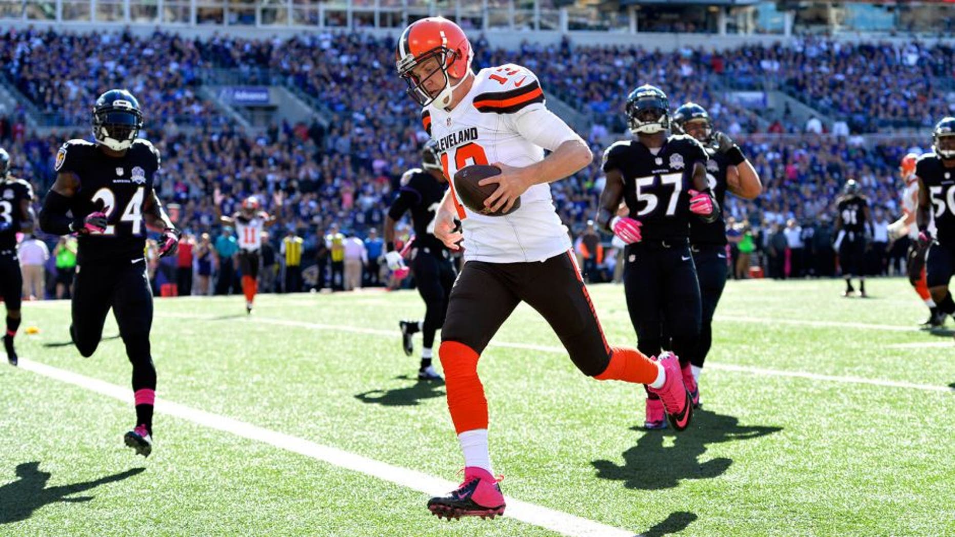 Oct 11, 2015; Baltimore, MD, USA; Cleveland Browns quarterback Josh McCown (13) scores a touchdown during the third quarter against the Baltimore Ravens at M&T Bank Stadium. Mandatory Credit: Tommy Gilligan-USA TODAY Sports