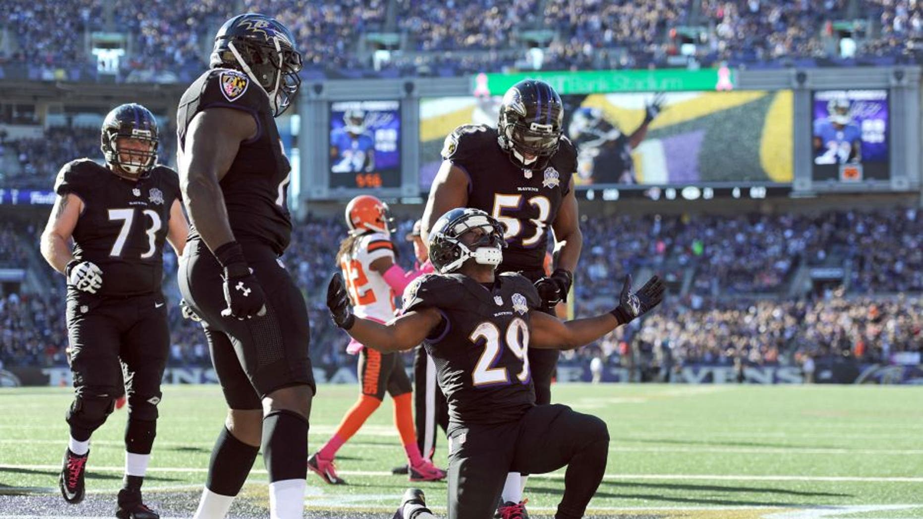 Baltimore Ravens running back Justin Forsett (29) celebrates his touchdown with teammates in the second half of an NFL football game against the Cleveland Browns, Sunday, Oct. 11, 2015, in Baltimore. (AP Photo/Gail Burton)