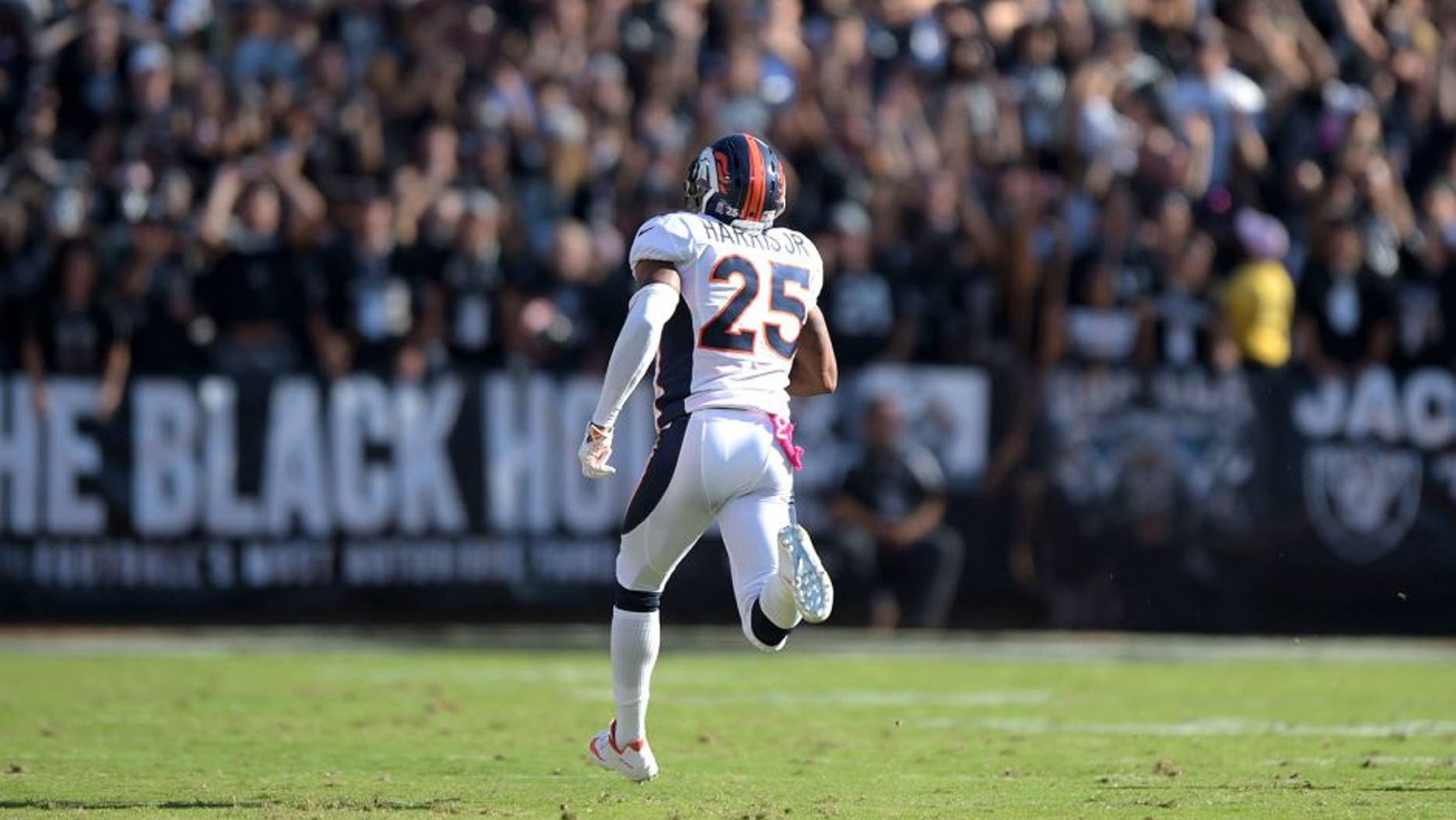 Oct 11, 2015; Oakland, CA, USA; Denver Broncos cornerback Chris Harris Jr. (25) scores on a 75-yard interception return in the fourth quarter against the Oakland Raiders at O.co Coliseum. Mandatory Credit: Kirby Lee-USA TODAY Sports