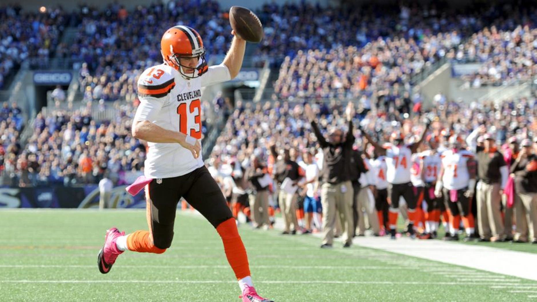 Cleveland Browns quarterback Josh McCown scores a touchdown in the second half of an NFL football game against the Baltimore Ravens, Sunday, Oct. 11, 2015, in Baltimore. (AP Photo/Gail Burton)
