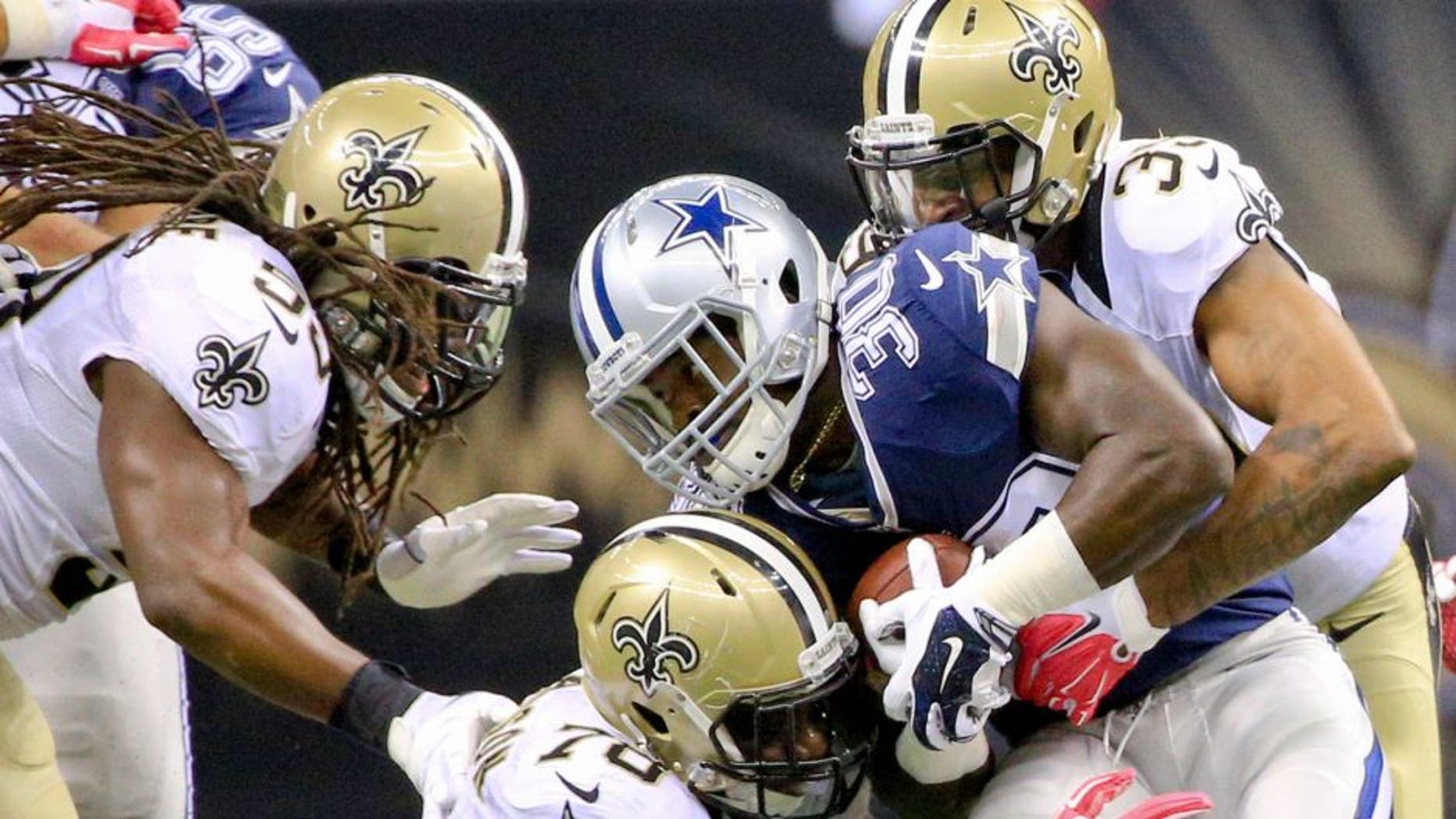 Oct 4, 2015; New Orleans, LA, USA; New Orleans Saints cornerback Brandon Browner (39) and defensive end Bobby Richardson (78) tackle Dallas Cowboys running back Christine Michael (30) during the fourth quarter at the Mercedes-Benz Superdome. The Saints won 26-20 in overtime. Mandatory Credit: Derick E. Hingle-USA TODAY Sports