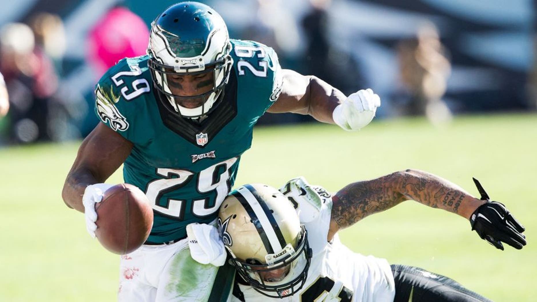 Oct 11, 2015; Philadelphia, PA, USA; Philadelphia Eagles running back DeMarco Murray (29) is tackled by New Orleans Saints strong safety Kenny Vaccaro (32) during the fourth quarter at Lincoln Financial Field. The Eagles won 39-17. Mandatory Credit: Bill Streicher-USA TODAY Sports