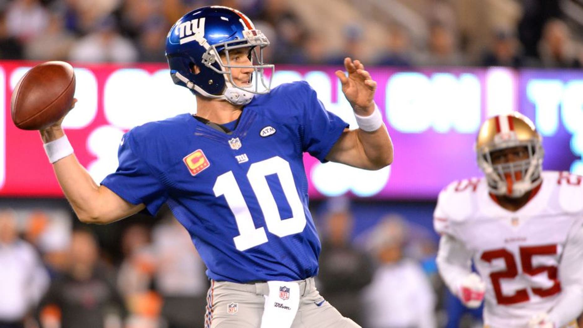 Oct 11, 2015; East Rutherford, NJ, USA; New York Giants quarterback Eli Manning (10) throws the ball in the first quarter against the San Francisco 49ers at MetLife Stadium. Mandatory Credit: Robert Deutsch-USA TODAY Sports
