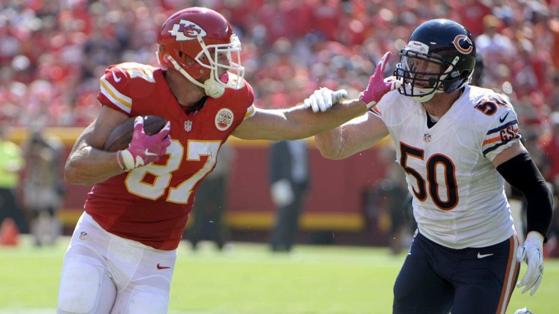 Oct 11, 2015; Kansas City, MO, USA; Chicago Bears inside linebacker Shea McClellin (50) reaches to tackle Kansas City Chiefs tight end Travis Kelce (87) in the first half at Arrowhead Stadium. Mandatory Credit: John Rieger-USA TODAY Sports
