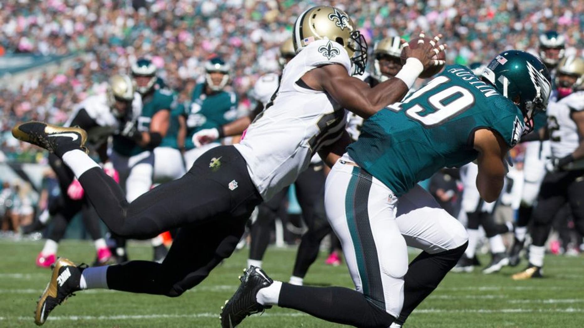 Oct 11, 2015; Philadelphia, PA, USA; New Orleans Saints cornerback Delvin Breaux (40) intercepts a pass intended for Philadelphia Eagles wide receiver Miles Austin (19) during the second quarter at Lincoln Financial Field. Mandatory Credit: Bill Streicher-USA TODAY Sports