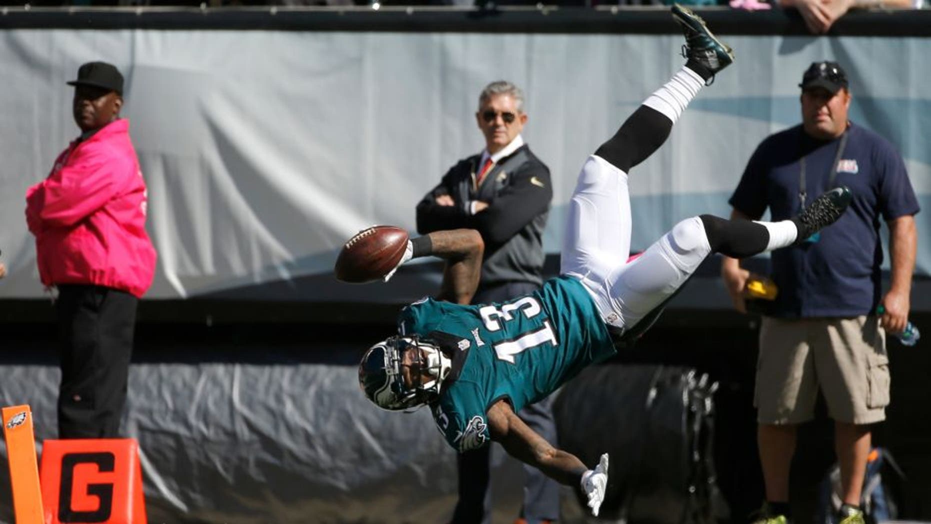 Philadelphia Eagles' Josh Huff flips into the end zone for a touchdown during the first half of an NFL football game against the New Orleans Saints, Sunday, Oct. 11, 2015, in Philadelphia. (AP Photo/Michael Perez)