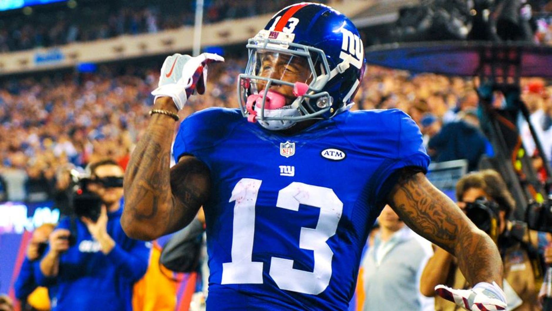 EAST RUTHERFORD, NJ - OCTOBER 11: Odell Beckham #13 of the New York Giants celebrates a touchdown in the third quarter during a game against the San Francisco 49ers at MetLife Stadium on October 11, 2015 in East Rutherford, New Jersey. (Photo by Alex Goodlett/Getty Images)