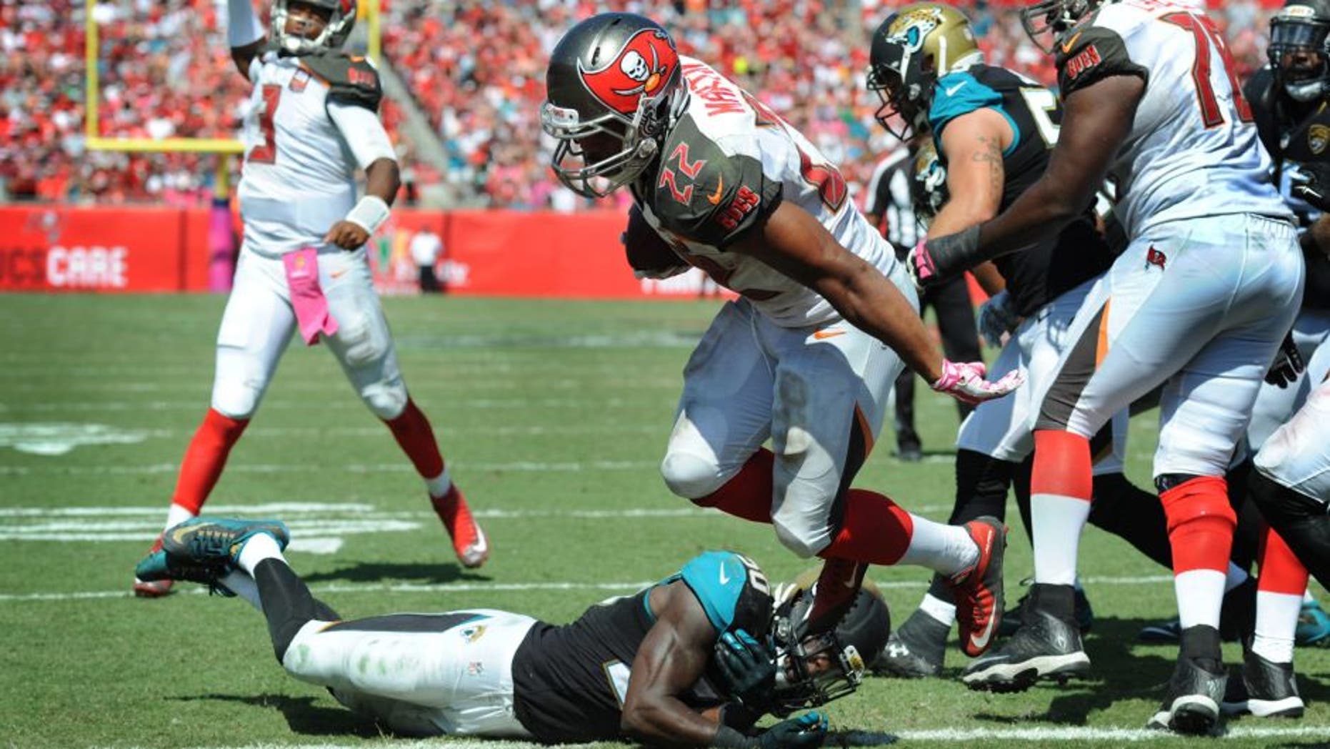 TAMPA, FL - OCTOBER 11: Running back Doug Martin #22 of the Tampa Bay Buccaneers scores a touchdown against the Jacksonville Jaguars in the second quarter at Raymond James Stadium on October 11, 2015 in Tampa, Florida. (Photo by Cliff McBride/Getty Images)