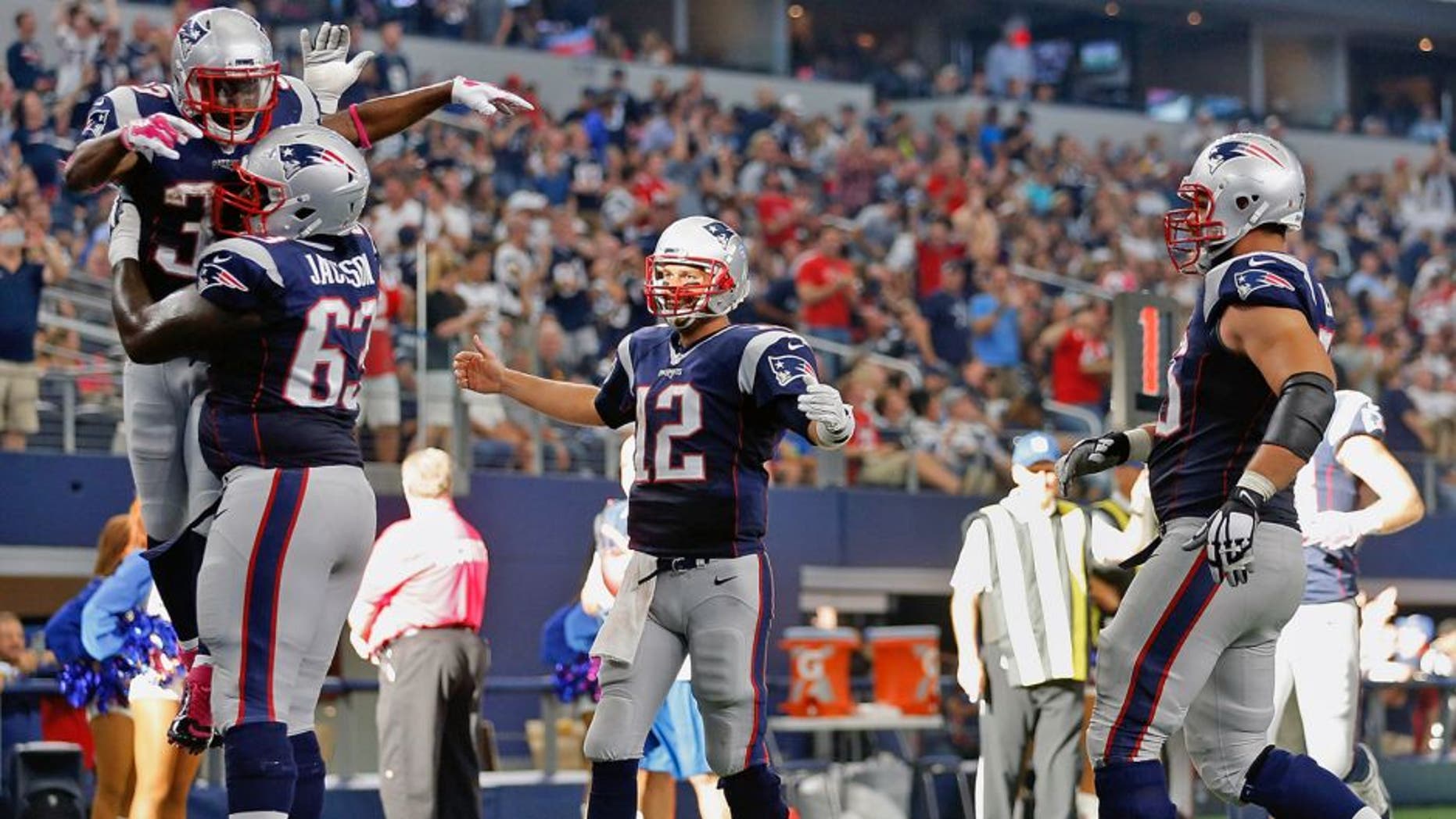 ARLINGTON, TX - OCTOBER 11: Running back Dion Lewis #33 of the New England Patriots is lifted in the air by offensive guard Tre Jackson #63 after scoring on a ten yard touchdown reception from quarterback Tom Brady #12 during the second half of the NFL game against the Dallas Cowboys at AT&T Stadium on October 11, 2015 in Arlington, Texas. (Photo by Christian Petersen/Getty Images)